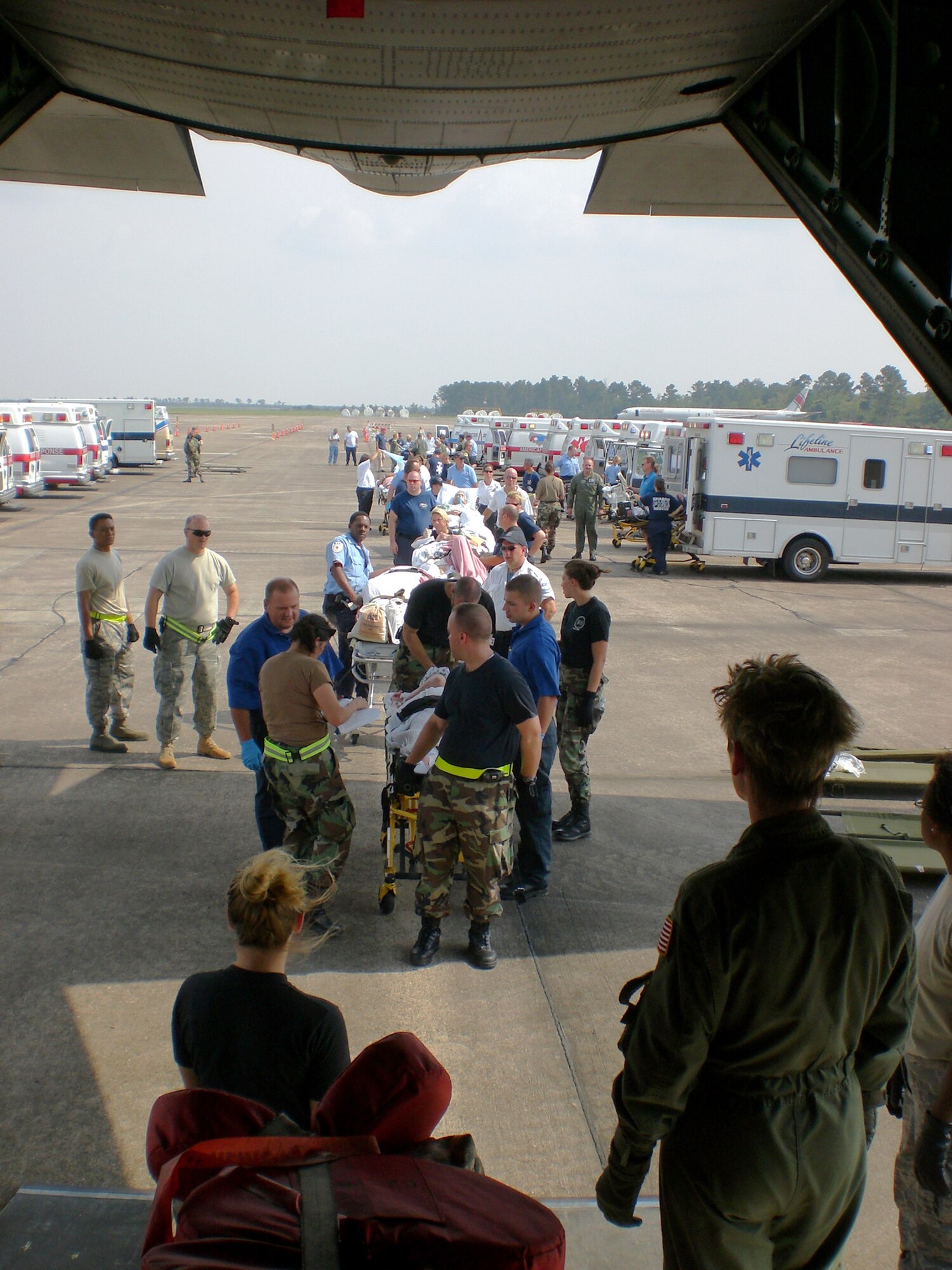Aeromedical Evacuation personnel begin loading patients onto an aircraft. The 445th Aeromedical Evacuation Squadron provided support during two hurricanes and was an integral part of the safe movement of more than 400 people. (Courtesy photo) 