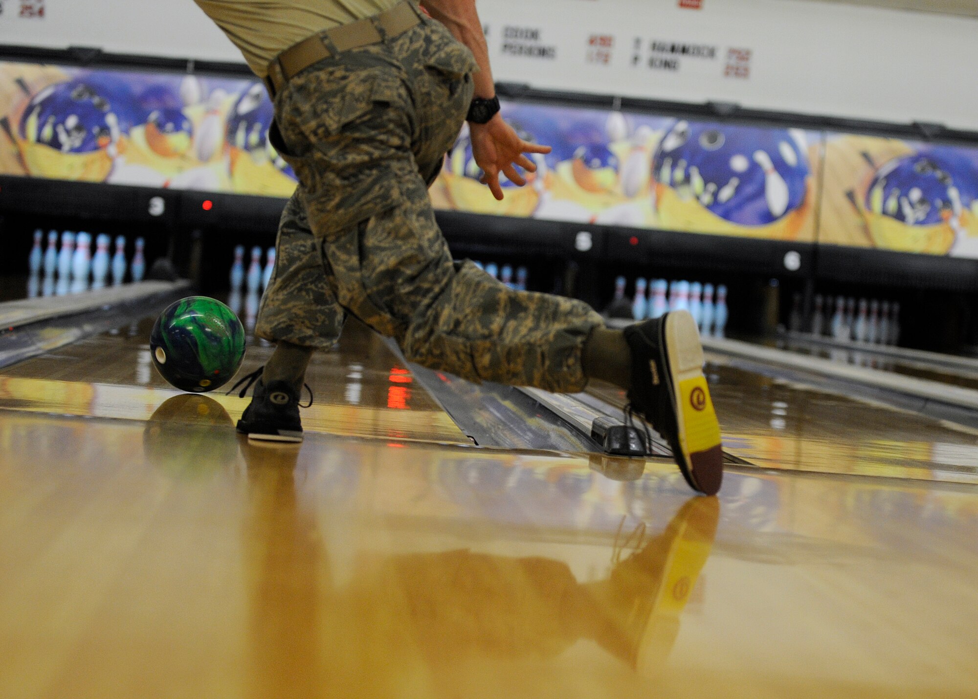 MOODY AIR FORCE BASE, Ga. – Airman 1st Class Kyle Wilkes, 723rd Aircraft Maintenance Squadron, throws a bowling ball during a match Oct. 17 here. Super Sports Day included many sporting events open to all Team Moody members. (U.S. Air Force photo by Senior Airman Brittany Barker)
