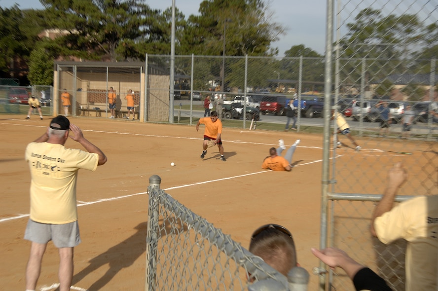 MOODY AIR FORCE BASE, Ga. -- During Super Sports Day, colonels and chief master sergeants representing different Moody organizations came together to face off in a one pitch softball game Oct. 17 here. Super Sports Day provided Airmen and families a chance to relax and come together to compete in sporting events. (U.S. Air Force Photo by Senior Airman Javier Cruz)