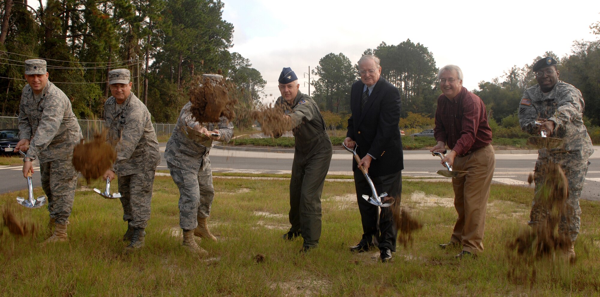 MOODY AIR FORCE BASE, Ga. – Col. Kenneth Todorov, 23rd Wing Commander, leads the way during a ground breaking ceremony Oct. 14 here. The 23rd Civil Engineer Squadron hosted several ground-breaking ceremonies to celebrate the beginning of construction on a new dormitory, base gate and engine repair shop. (U.S. Air Force photo by Airman Joshua Green) 