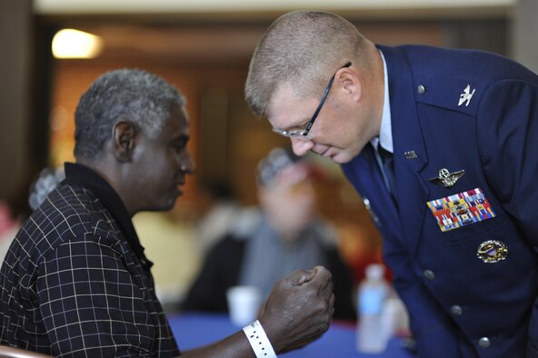 Col. Robert Bender, the 704th Mission Support Group commander at Arnold, listens as Benjamin Lindsey, who was an Army Specialist serving in Vietnam, shares his memories during AEDC’s annual VA Picnic at the Arnold Lakeside Club Oct. 3. Colonel Bender, representing center Commander Col. Art Huber, welcomed the veterans to Arnold and gave the opening remarks at the beginning of the event. He also helped serve the picnic lunch and circulated among the veterans, listening to them as they related past experiences and shared their perspective of current events and concerns. Lindsey lives at the VA Tennessee Valley Healthcare System’s Alvin C. York Murfreesboro campus. (Photo by Rick Goodfriend)