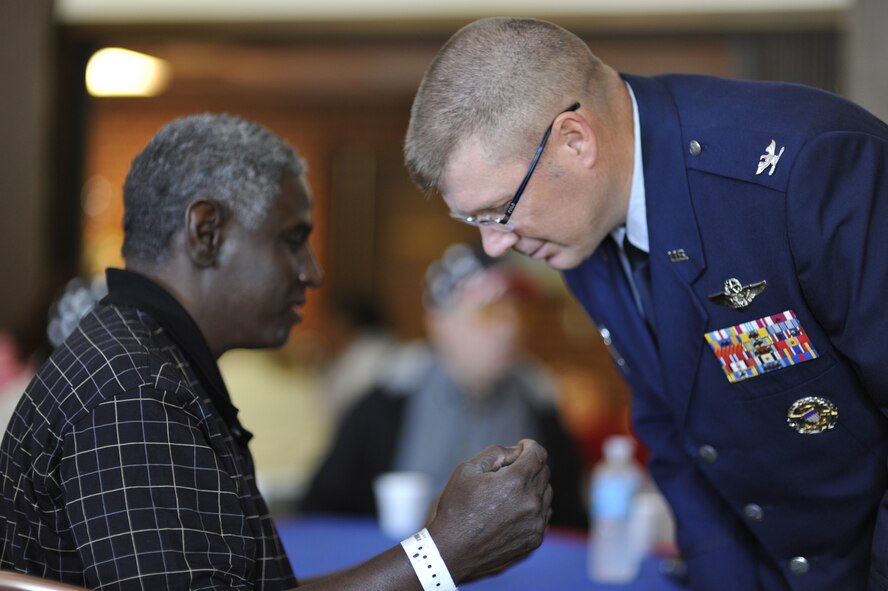 Col. Robert Bender, the 704th Mission Support Group commander at Arnold, listens as Benjamin Lindsey, who was an Army Specialist serving in Vietnam, shares his memories during AEDC’s annual VA Picnic at the Arnold Lakeside Club Oct. 3. Colonel Bender, representing center Commander Col. Art Huber, welcomed the veterans to Arnold and gave the opening remarks at the beginning of the event. He also helped serve the picnic lunch and circulated among the veterans, listening to them as they related past experiences and shared their perspective of current events and concerns. Lindsey lives at the VA Tennessee Valley Healthcare System’s Alvin C. York Murfreesboro campus. (Photo by Rick Goodfriend)