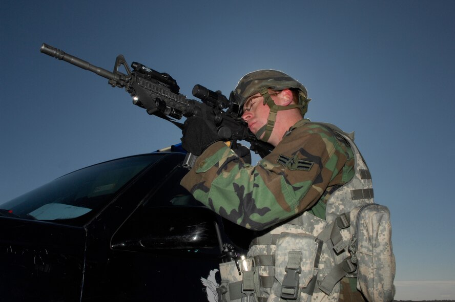 MINOT AIR FORCE BASE, N.D. -- Airman 1st Class Troy Smith, 5th Security Forces Squadron, maintains the perimeter of a B-52H Stratofortress that was “attacked” by a simulated suicide bomber during an All Hazards Response Training exercise here Oct. 15. The exercise was designed to test responding agencies’ capabilities during a crisis scenario. (U.S. Air Force photo by Senior Airman Joe Rivera)