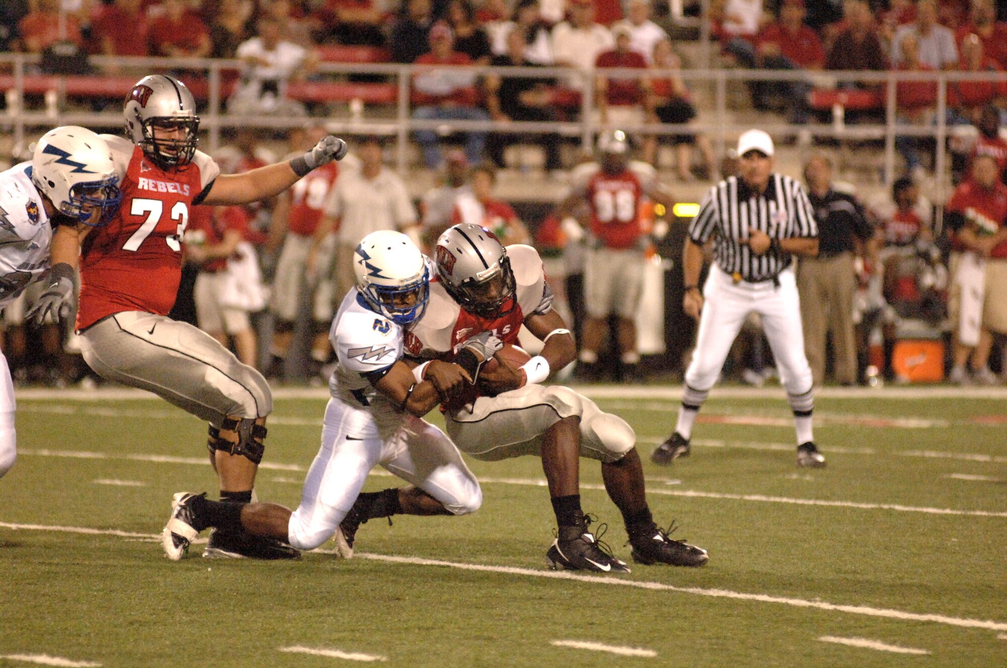 U.S. Air Force Academy cornerback Reggie Rembert sacks University of Nevada, Las Vegas quarterback Omar Clayton. The resulting 9-yard loss pushed UNLV to fourth and 16 and forced a punt on UNLV?s first possession of the game. The Falcons won 29-28 and improved to 5-2 on the season and 3-1 in the Mountain West Conference. (U.S. Air Force photo/John Van Winkle) 
