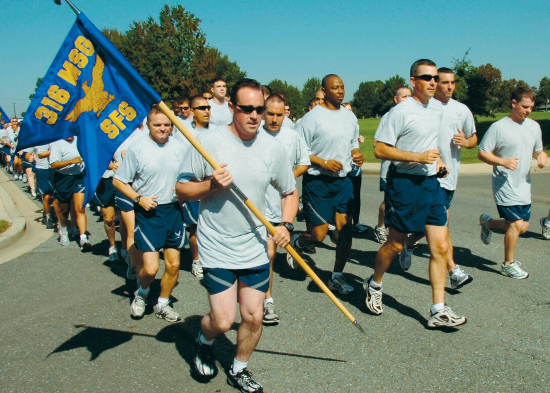 316th Wing Security Forces Squadron members were among several 316 WG squadrons to participate in a 1.6 mile run during a wing fun run Oct. 10. The event started with stretching, pushups and situps and concluded with music and a barbecue.  (U.S. Air Force photo by Bobby Jones)