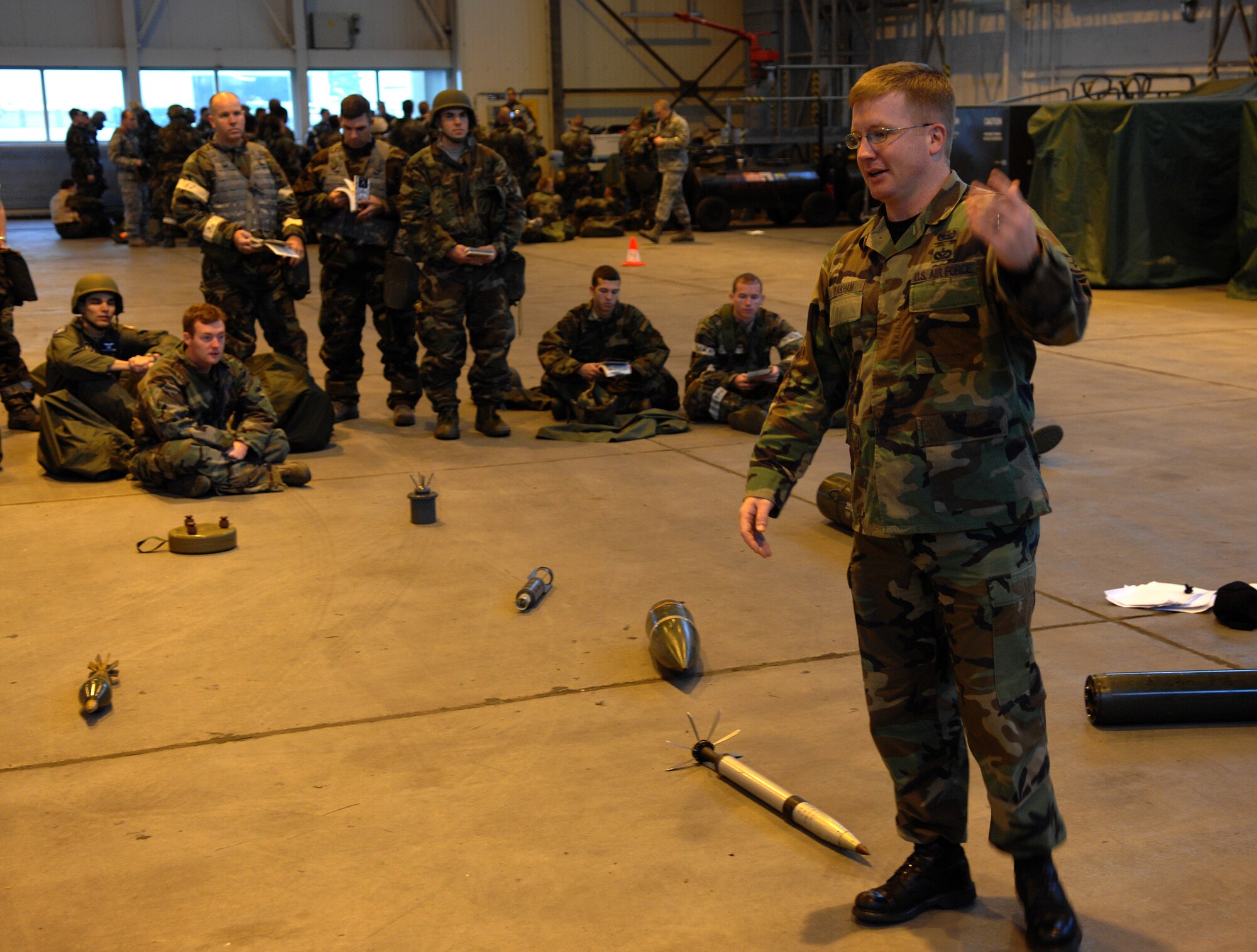 Technical Sgt. Christopher Wakham, 835th Civil Engineer Squadron, Explosive Ordinance Disposal, gives instruction on explosive ordinances during Warrior Preparation Day, Ramstein Air Base, Germany, Oct. 17, 2008. Warrior Prep Day is a training effort to prepare Airmen of all ranks for upcoming deployments by instructing them on the potential threats and effective emergency response actions in a deployed enviroment. (U.S. Air Force photo by Airman 1st Class Tony R. Ritter)(Released)
