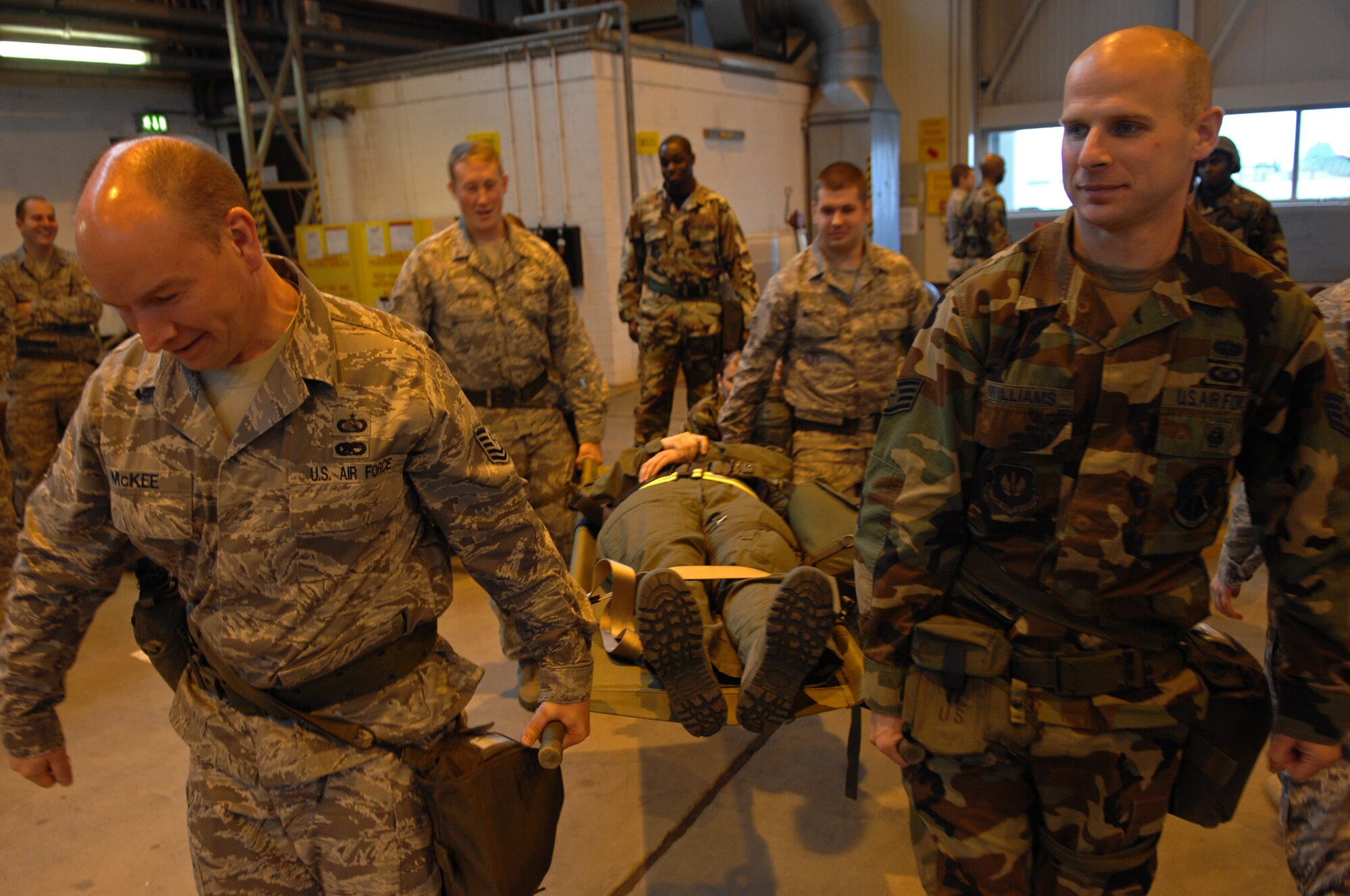 Participants of Warrior Preparation Day exercise methods of safely transporting an injured victim on a litter, Ramstein Air Base, Germany, Oct. 17, 2008. Warrior Prep Day is a training effort to prepare Airmen of all ranks for upcoming deployments by instructing them on the potential threats and effective emergency response actions in a deployed enviroment. (U.S. Air Force photo by Airman 1st Class Tony R. Ritter)(Released)