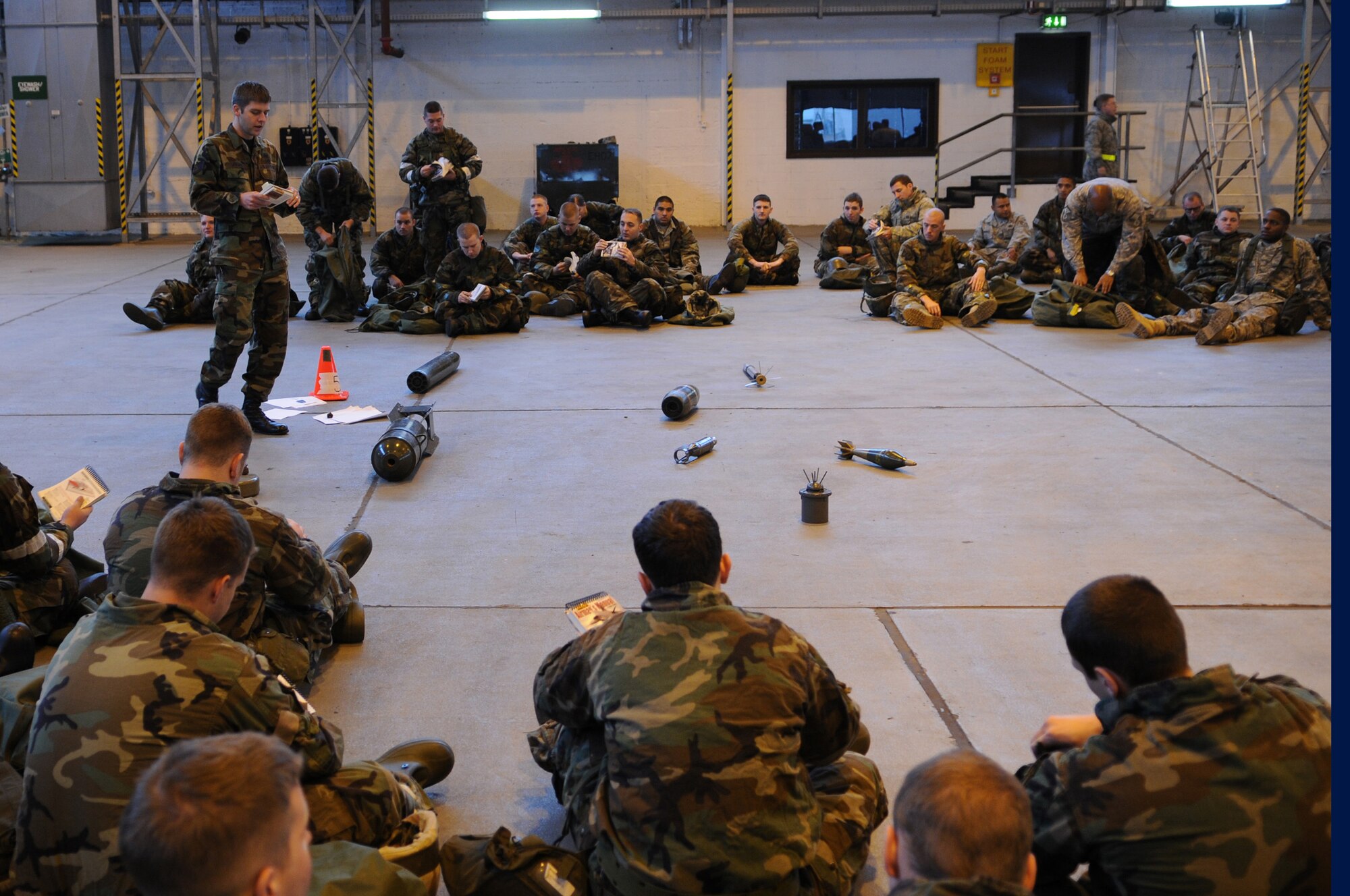 Air Force Staff Sgt. Dustin Jolman, 835th Civil Engineer Squadron explosive ordinance technician, gives a briefing on explosives ordinance reconnaissance to members in training during warrior prep day, Ramstein Air Base, Germany, Oct. 17, 2008. The training is to enhance their ability to support the mission while on base or while being deployed. (U.S. Air Force photo by Airman 1st Class Caleb Pierce)(Released)