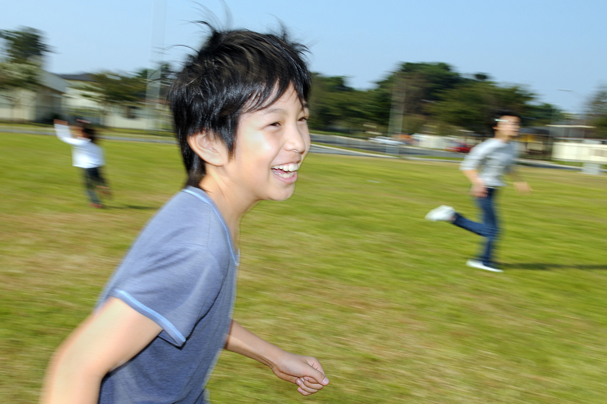MISAWA AIR BASE, Japan -- Hama Taiki, an Oirase Town 5th grader, avoids being tagged during the Children's Cultural Exchange Oct. 18, 2008, at Sollars Elementary School. Games such as freeze tag and leap frog were played, allowing American and Japanese children the chance to bond and learn more about each other. (U.S. Air Force photo by Airman 1st Class Jamal D. Sutter)