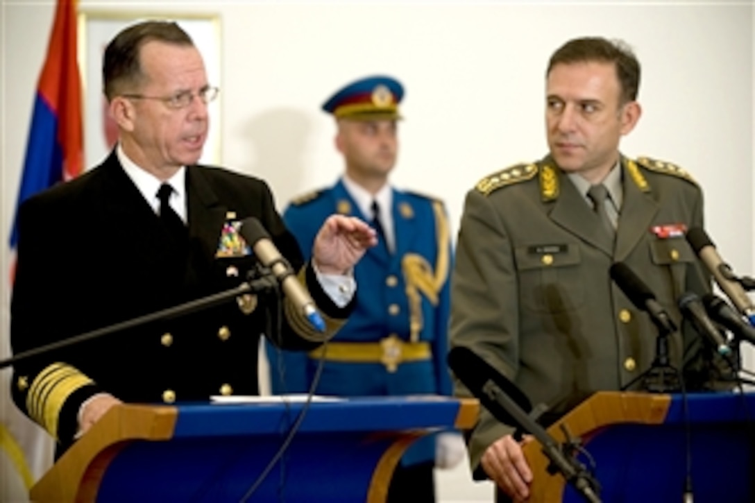U.S Navy Adm. Mike Mullen, chairman of the Joint Chiefs of Staff, and Gen. Zdravko Ponos, Serbian chief of defense, answer questions during a press conference in Belgrade, Serbia, Oct. 20, 2008. Mullen is on a three-day trip to the region to visit defense counterparts.