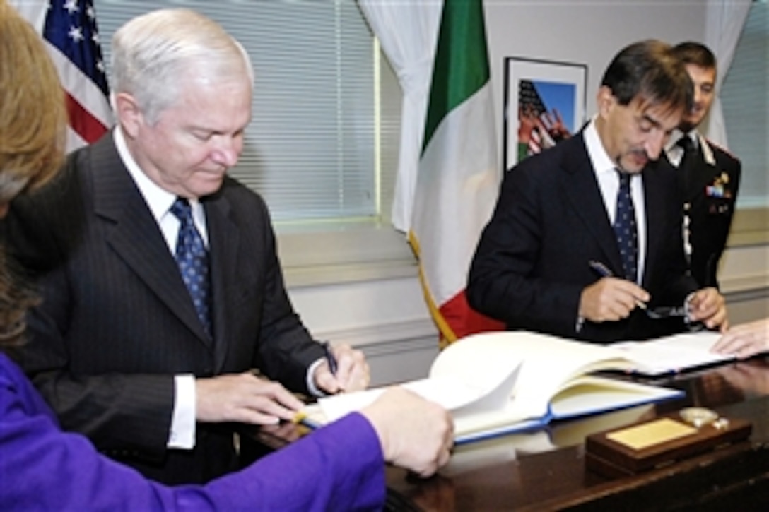 Defense Secretary Robert M. Gates, left, and Italian Minister of Defense Ignazio La Russa sign the Reciprocal Defense Procurement Memorandum of Understanding during a ceremony in the Pentagon, Oct. 20, 2008.