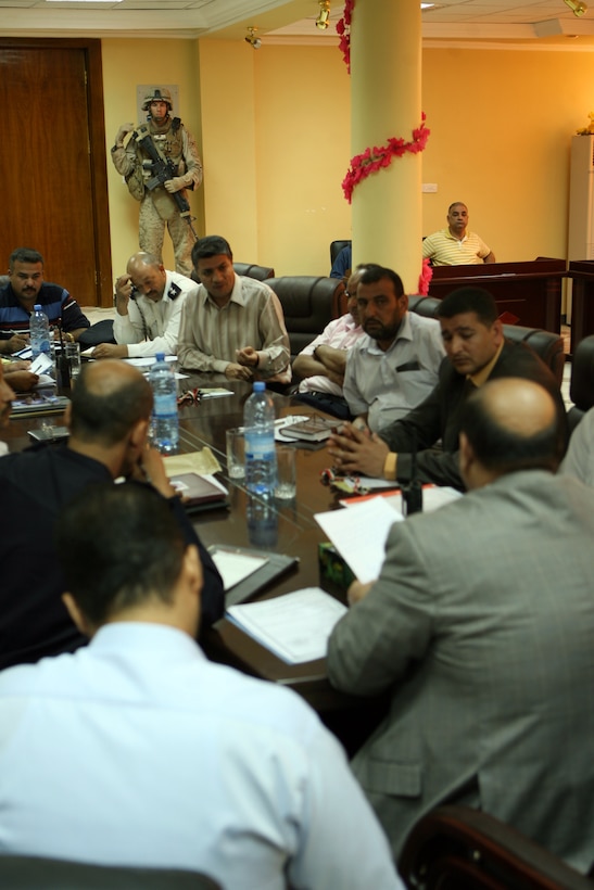 Mayor Latif Obaid Iyada al Chulaybawi meets with the Directors General of Ramadi at the Government Center in Ramadi Oct. 20. The mayor meets with the staff member weekly to discuss problems in the Ramadi area and he advises them on how to fix the problems.