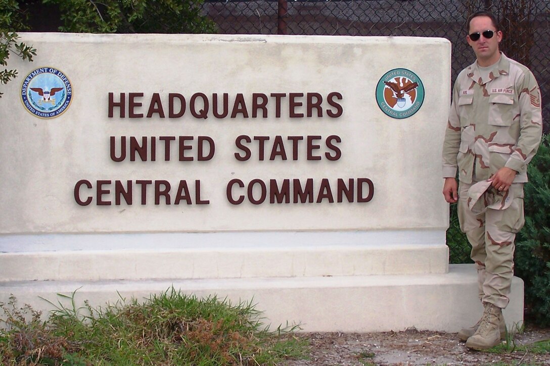 932nd Airlift Wing historian Master Sgt. Brady Kiel stands before the Headquarters of United States Central Command where he pulled a tour of duty in 2008.  The Air Force Reservist has rejoined the wing located in Illinois.  Photo submitted.