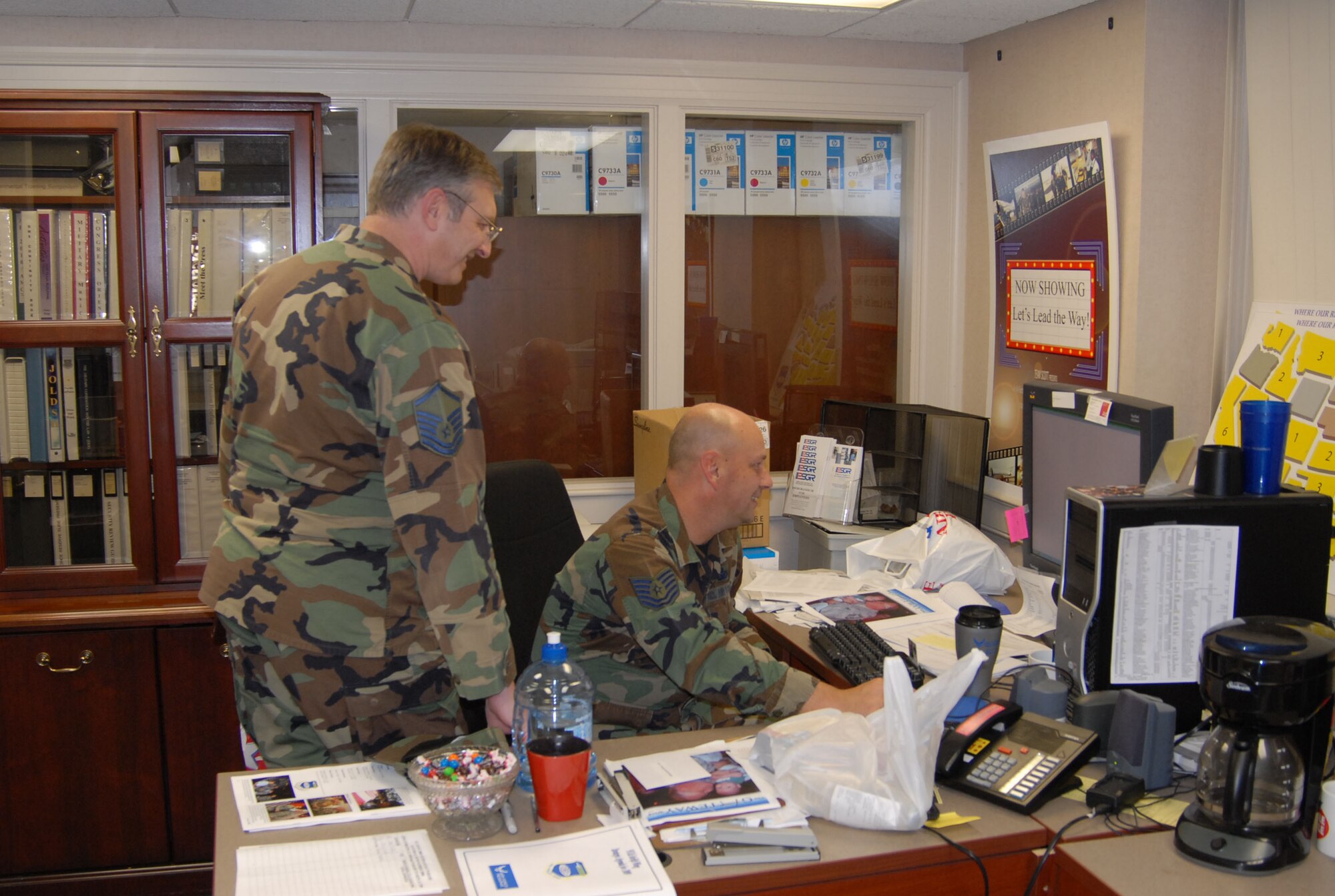932nd Airlift Wing unit deployment manager, Master Sgt. Harold Von De Bur, checks in with one his members, Tech. Sgt. Gerald Sonnenberg, regarding various drill weekend training they accomplished.  The Airmen are Air Force Reservists attached to Scott Air Force Base, Ill.  U.S. Air Force photo/Tech. Sgt. Danny Oliver