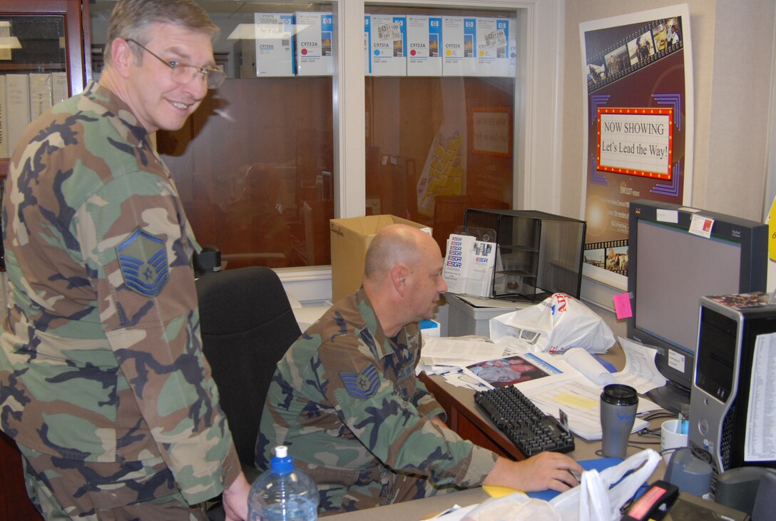 Unit training assembly at the 932nd Airlift Wing is a busy time for everyone!  The unit deployment manager, Master Sgt. Harold Von De Bur, checks in with one his members, Tech. Sgt. Gerald Sonnenberg, regarding various drill weekend training they accomplished. The Airmen are Air Force Reservists attached to Scott Air Force Base, Ill. U.S. Air Force photo/Tech. Sgt. Danny Oliver