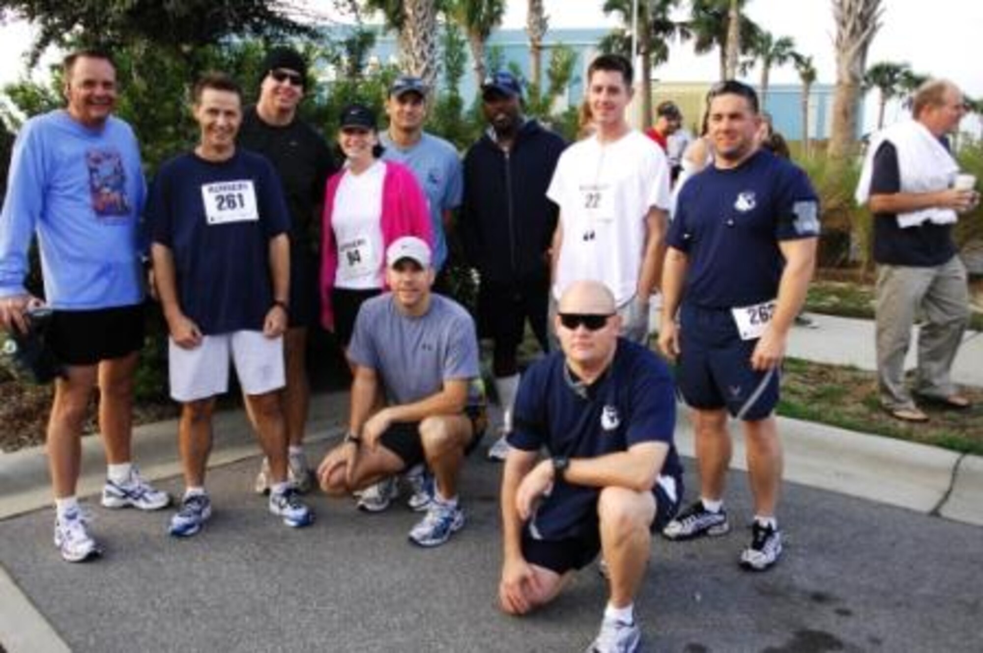 TYNDALL AIR FORCE BASE, Fla.  --  From left, Chief Master Sgt.  Malcom McVicar, Tech. Sgt. Charles Anderson, Tech. Sgt. Robert Wocking, Tech. Sgt. Heather Hodge, Tech. Sgt. Cameron Johnson, Tech. Sgt. Omari Lawrence, Tech. Sgt. Brandon Harold, Tech. Sgt. Chistopher Navarro, Tech. Sgt. Michael Doane, (kneeling) and Tech. Sgt. Sean Wells (kneeling,) all with the Airey NCO Academy.  The NCOs all participated in the first Girls Inc. Half Marathon held at Pier Park in Panama City Beach Oct. 18. (U.S. Air Force photo by Tech. Sgt. Parker Gyokeres) 