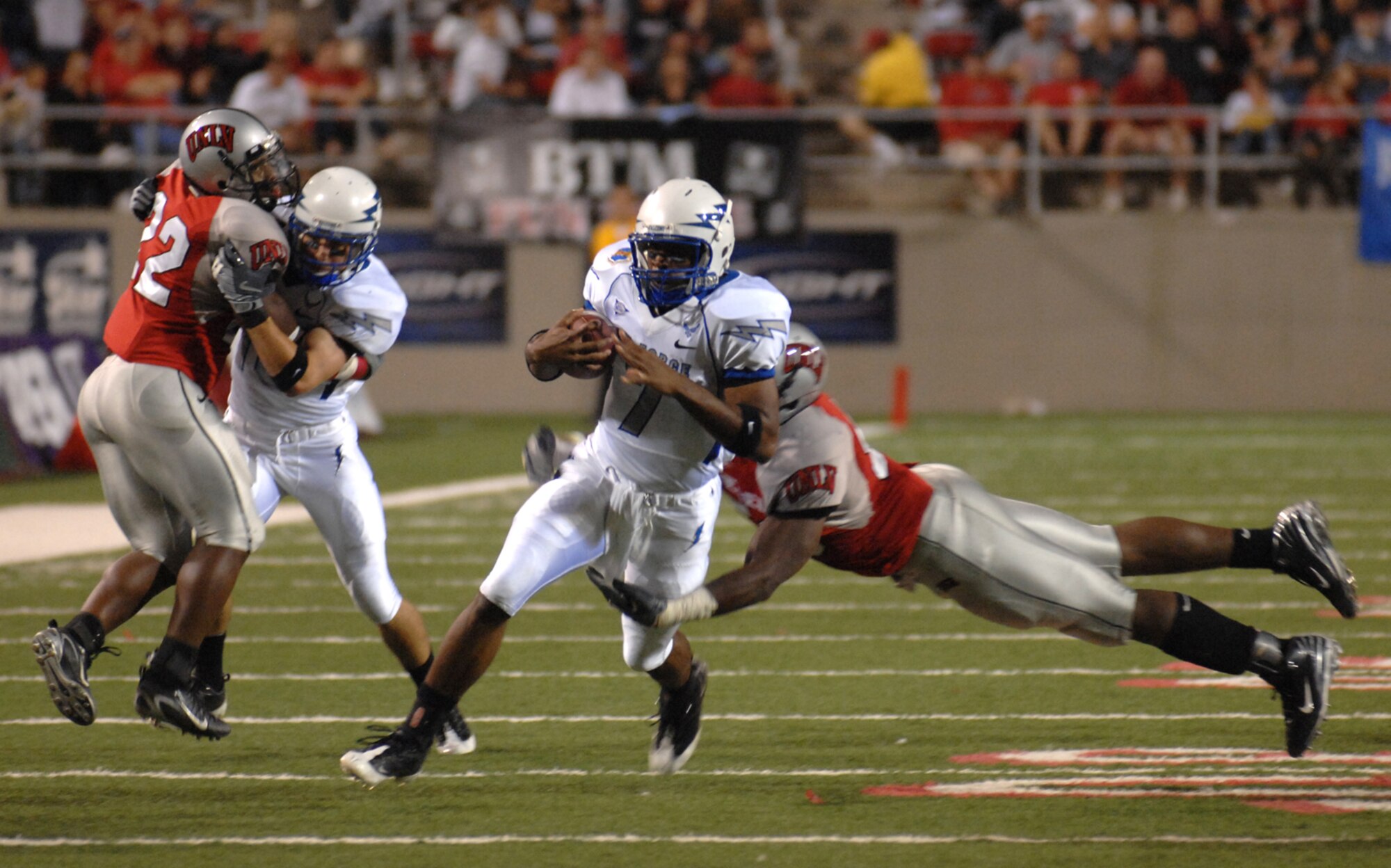 Air Force Falcons quarterback Tim Jefferson, eludes a defender for extra yards during the showdown against the University of Nevada Las Vegas Rebels, at Sam Boyd stadium Las Vegas, Nev. Oct. 18, 2008. The Falcons defeated the Rebels 29-28 and improved to 5-2 on the season and 3-1 in the Mountain West Conference.
(U.S. Air Force Photo/Senior Airman Larry E. Reid Jr.)