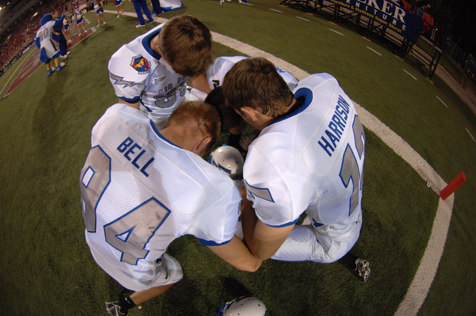 Air Force Falcons football players huddle for a word of prayer before their match up against the University of Nevada Las Vegas Rebels, at Sam Boyd stadium Las Vegas, Nev. October 18, 2008. The Falcons defeated the Rebels 29-28 and improved to 5-2 on the season and 3-1 in the Mountain West Conference.
(U.S. Air Force Photo/Senior Airman Larry E. Reid Jr.)