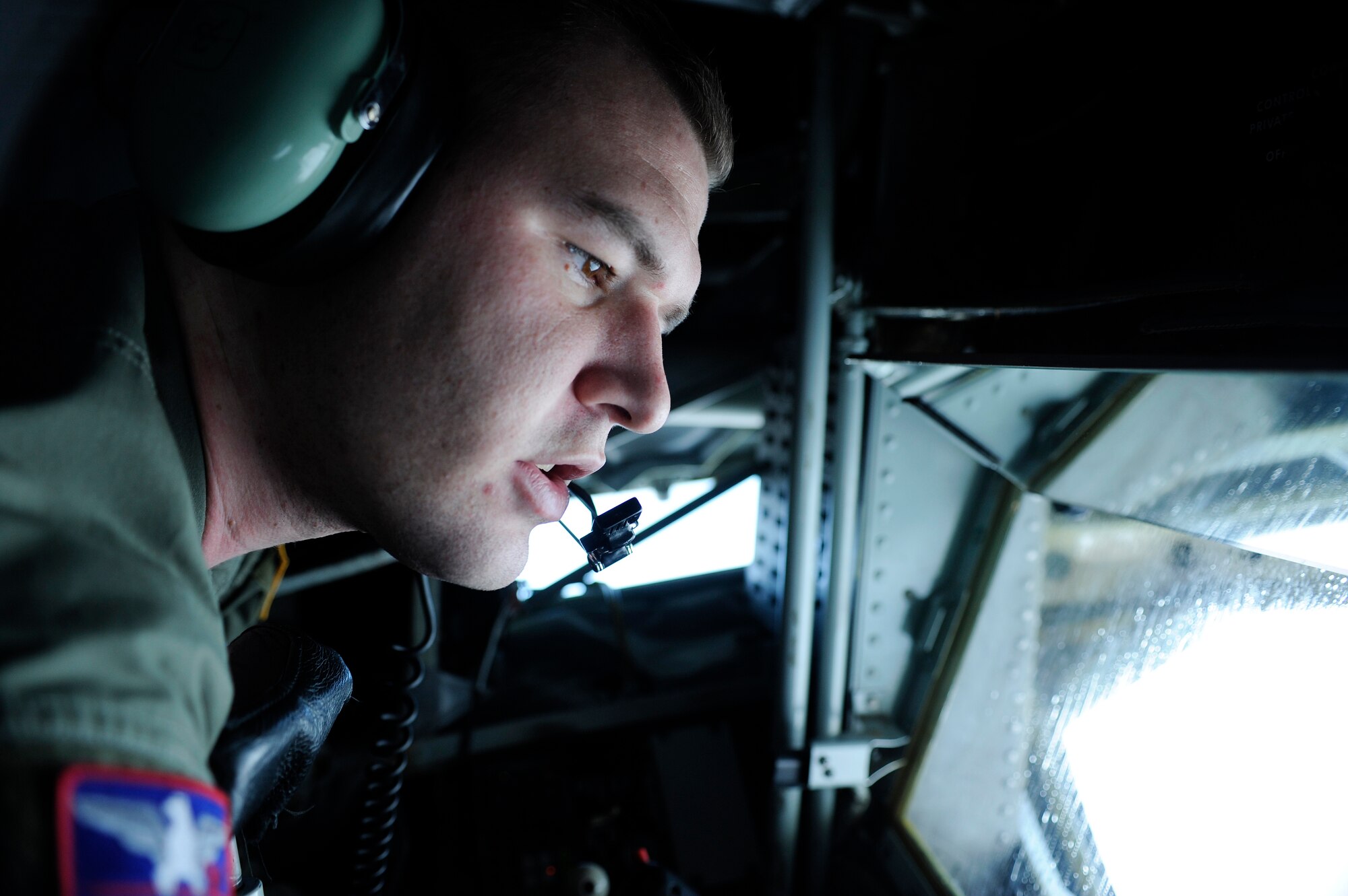 Senior Airman Parker McElroy communicates with a B-52 Stratofortress during an aerial refueling mission as part of RED FLAG-Alaska 09-1 Oct. 16, 2008, at Eielson Air Force Base, Alaska. B-52s flew a 23 hour long endurance mission from Anderson Air Base, Guam and an 18 hour flight from Barksdale Air Force Base, La. The B-52 is assigned to the 96th Bomb Squadron at Barksdale. Airman McElroy is assigned to the 384th Air Refueling Squadron, McConnell Air Force Base, Kan.  (U.S. Air Force photo/Senior Airman Jonathan Snyder)
