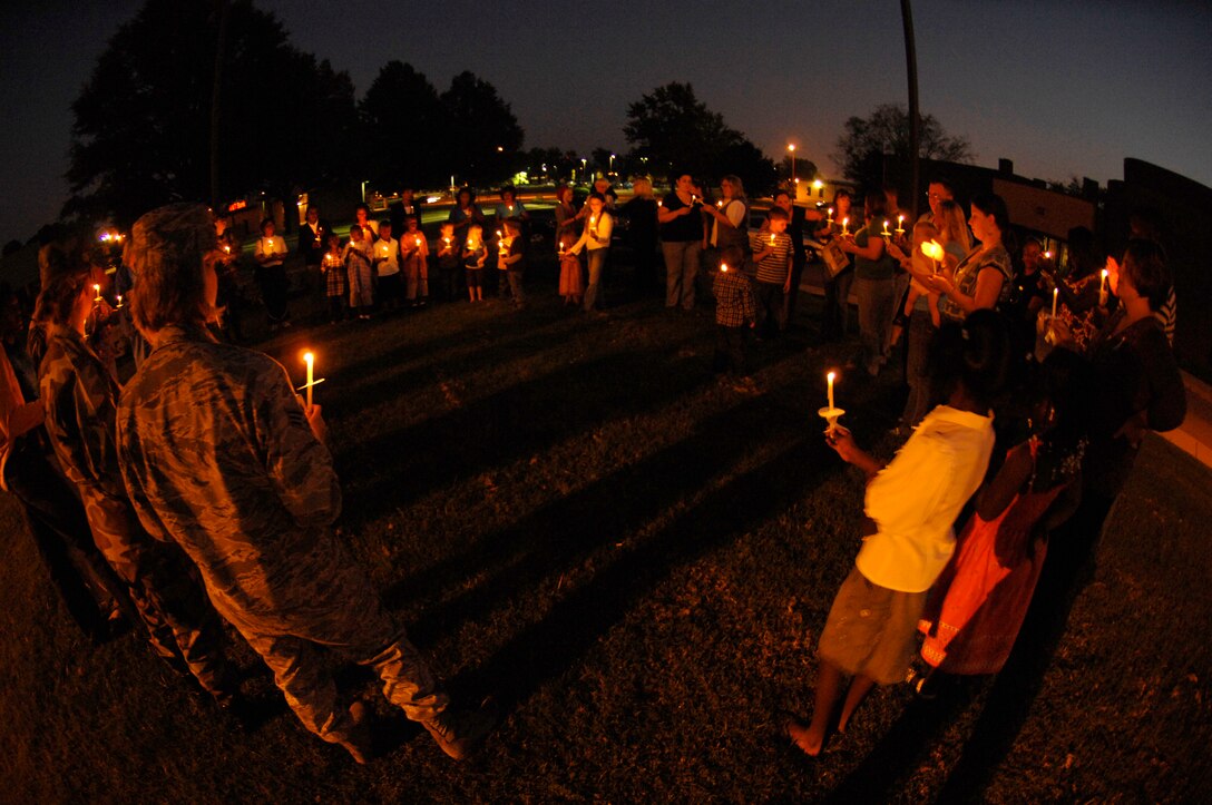 Grieving parents and friends hold a candlelight vigil for Pregnancy and Infant Loss Remembrance Day, Oct. 15.  On Sept. 28, 2006, House Resolution #222 was passed in the House of Representatives supporting the goals and ideals of Pregnancy and Infant Loss Remembrance Day promoting support, education and awareness for grieving parents worldwide. Over 50 family and friends attended the ceremony at Chapel 3. (U.S. Air Force photo/Senior Airman Steven R. Doty)