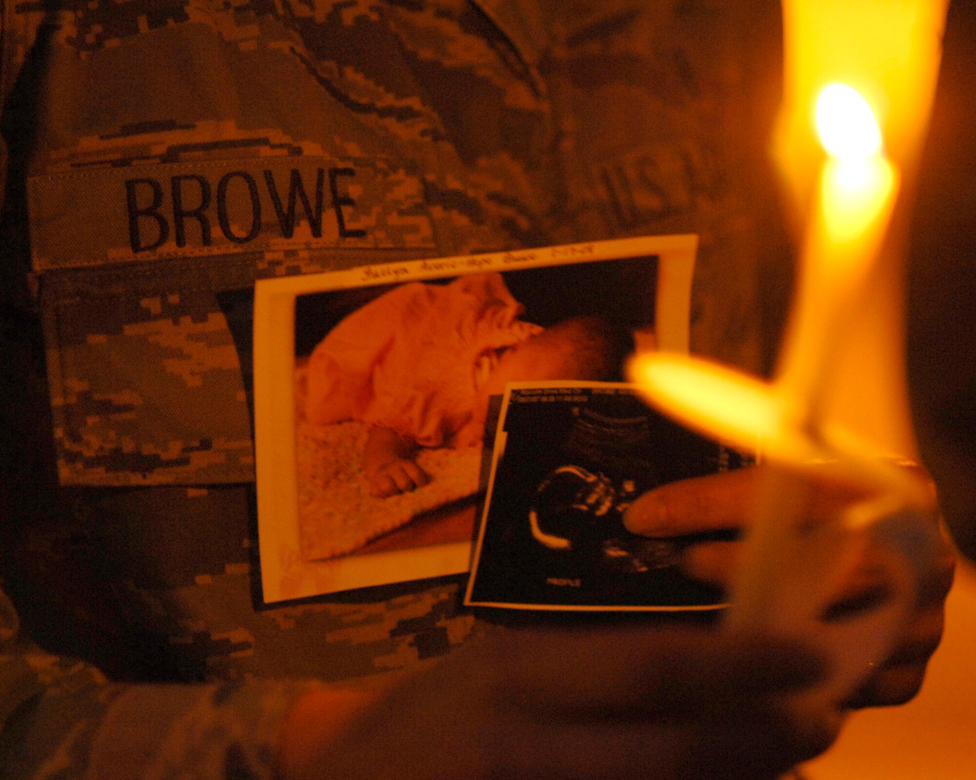 Senior Airman Ashlee Browe, 779th Medical Group Aerospace Medical Service Apprentice, holds a lighted candle in memoriam of her daughter Fallyn Averie-Hope Browe Oct. 15 at Chapel 3. Fallyn was born full term on Jan. 17, 2008 at 6 lbs 12 oz but passed away due to underdeveloped lungs and a displaced heart.  (U.S. Air Force photo/Senior Airman Steven R. Doty)