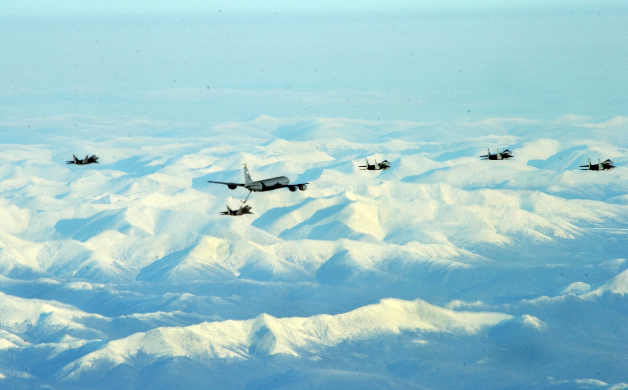 Two F-22 Raptors, a KC-135 Stratotanker and three F-15 Eagles fly in formation during RED FLAG Alaska 09-1 Oct. 17 at Eielson Air Force Base, Alaska. RED FLAG-Alaska is a series of Pacific Air Forces field training exercises for U.S Forces and allies that provide joint offensive counter-air, interdiction, close air support, and large force employment in a simulated combat environment. (U.S. Air Force photo Airman Laura Max)