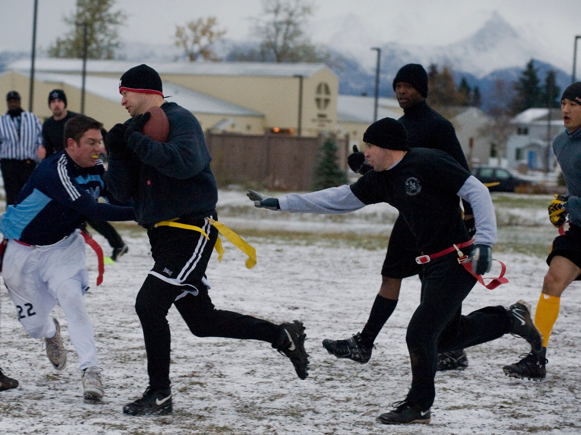 ELMENDORF AIR FORCE BASE Alaska -- Capt. Ronnie Evans, 962nd Airborne Air Control Squadron, evades the defense of the 381st Intelligence Squadron during the intramural flag football championship game here Oct. 9. The 962nd AACS rallied together to win two in a row over the 381st IS. (U.S. Air Force photo/Staff Sgt. Joshua Garcia) 