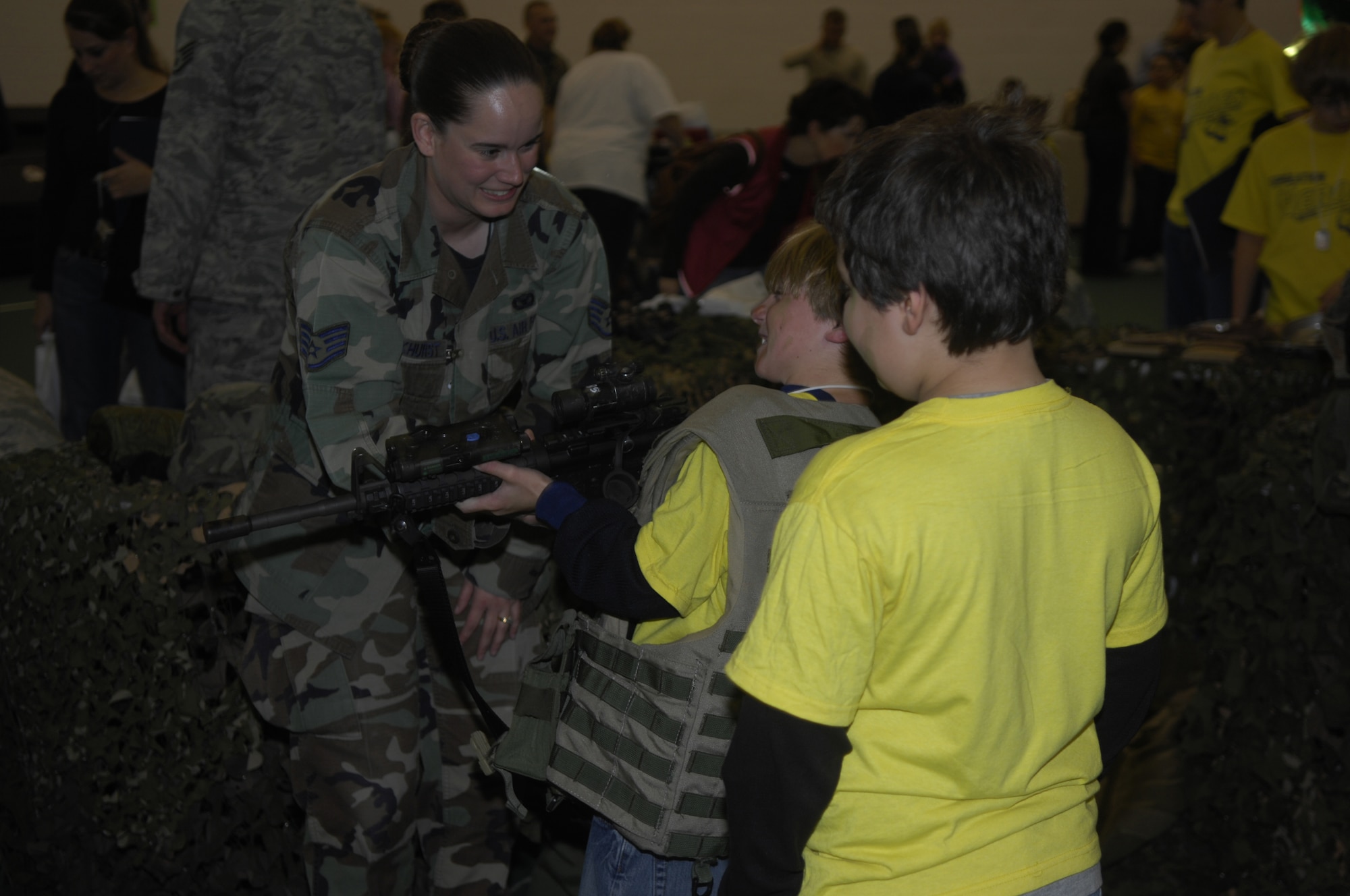 MINOT AIR FORCE BASE, N.D. -- Staff Sgt. Tanya Parkhurst, 5th Security Forces Squadron, instructs children on the correct way to hold an M-16A2 rifle during the 2nd annual Operation HEROES here Oct. 21. The purpose of the Operation HEROES was to give children of deploying family members a better understanding of what their military parents go through in order to deploy. This year, more than 400 participated in the deployment to “KIDakastan.” (U.S. Air Force photo Senior Airman Joe Rivera)  