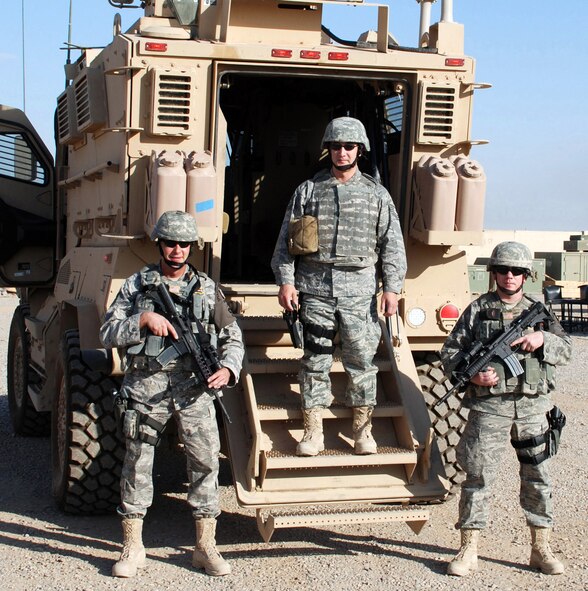Tech. Sgt. Michael Pate (left), Tech. Sgt. Richard Shumate (middle), and Staff Sgt. Shaun Feero, all from the 446th Security Forces Squadron, McChord Air Force Base, Wash., stand tall and ready to roll in front of one of their new Mine Resistant Ambush Protected armored vehicles. The three NCO?s are currently on a deployment with the 506th Expeditionary Security Forces Squadron, Kirkuk Regional Air Base, Iraq in support of Operation Iraqi Freedom. (U.S. Air Force photo/Master Sgt. Mark Japuncha)