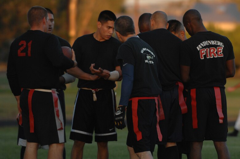 VANDENBERG AIR FORCE BASE, Calif. -- The Firefighters' flag football team huddle before taking the field against the 30 Space Wing team on October. The Firefighters had an 18-0 victory over the 30th Space Wing. Vandenberg Flag Football season began earlier this month. (U.S. Air Force photo by Senior Airman Nicole Roberts)  