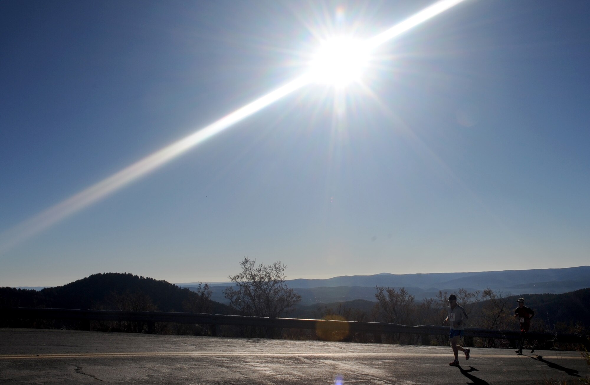CANNON AIR FORCE BASE, N.M.  -- Runners race during the ski run road challenge in Ruidoso, N.M., Oct. 18. The race was the 2nd annual New Mexico's 20K high-altitude challenge. (U.S. Air Force photo/Senior Airman Liliana Moreno) 