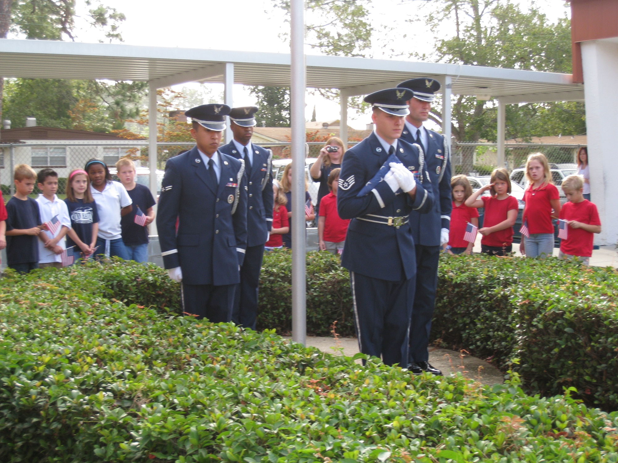 Tyndall Air Force Base Honor Guard showcase proper American Flag etiquette to a Lynn Haven Elementary 3rd grade class Tuesday.  The Honor Guard educated the children from Mrs. Amy Harvey’s class on proper handling of the U.S. flag.  Mrs. Harvey’s classroom is located next to the flag pole, and her class has been tasked with the honor of raising and lowering the flag each school day. (U.S. Air Force photo by: Maj. Veronica Kemeny)