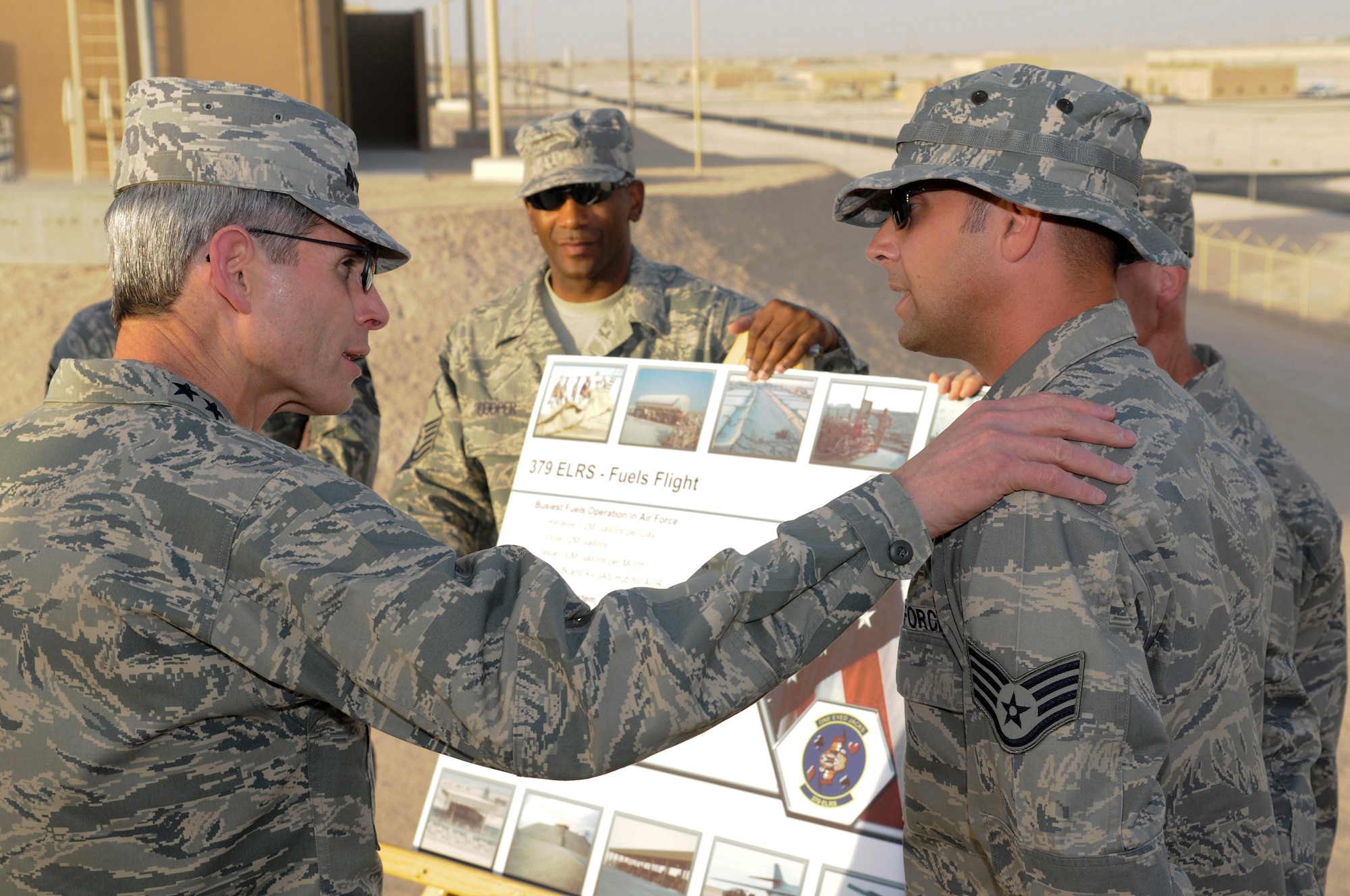Air Force Chief of Staff Gen. Norton Schwartz asks questions of Staff Sgt. Matthew Cramer about fuels procedures at the 379th Air Expeditionary Wing Oct. 20.  The visit marked the CSAF's first trip to the U.S. Air Forces Central area of responsibility since his appointment as the Air Force chief of staff. Sergeant Cramer is assigned to the  379th Expeditionary Logistics Readiness Squadron. (U.S. Air Force photo/Tech. Sgt. Michael Boquette)