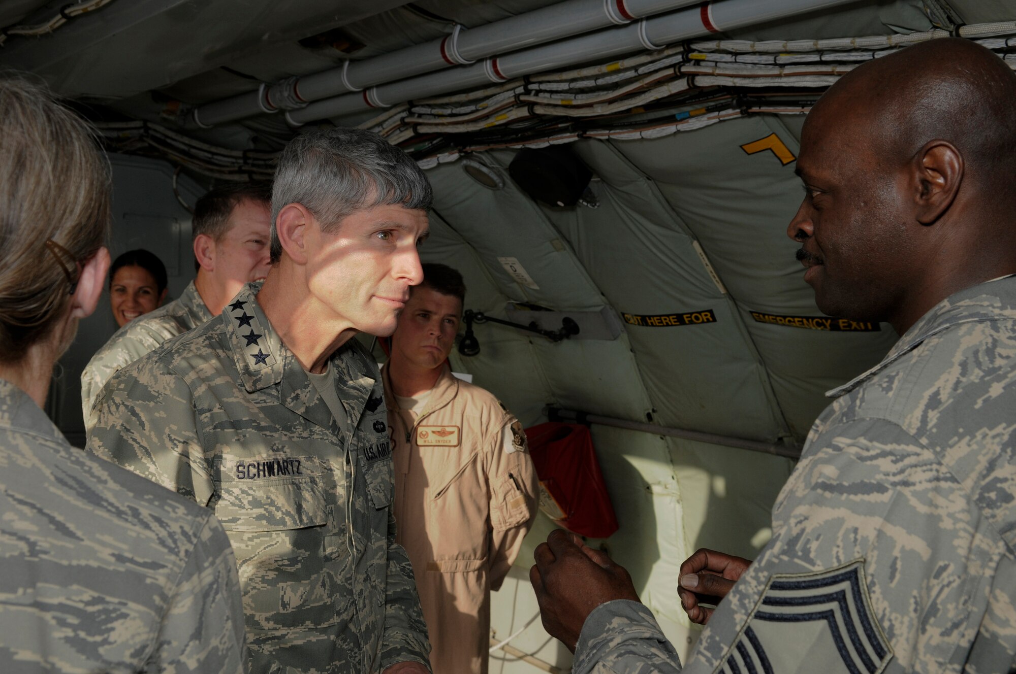 Chief Master Sgt. Antonio Baxter discusses KC-135 maintenance issues with Air Force Chief of Staff Gen. Norton Schwartz Oct. 20. The 379th Air Expeditionary Wing is General Schwartz's first stop on his first tour of the U.S. Air Forces Central area of responsibility since his appointment as the Air Force chief of staff. Chief Baxter is assigned to the 340th Aircraft Maintenance Unit. (U.S. Air Force photo/Tech. Sgt. Michael Boquette)