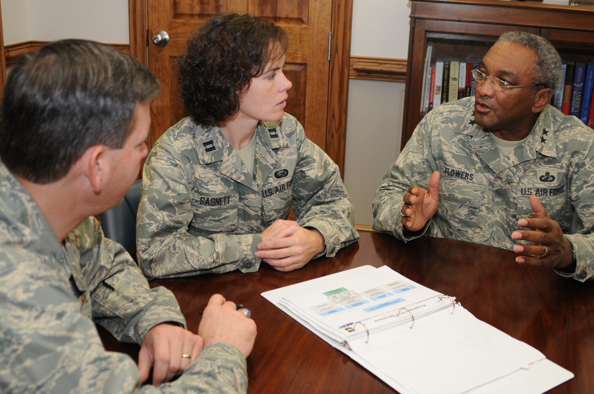 Col. Andrew Cain, left, chief of 2nd Air Force’s technical training operations center operations division, Captain Sasnett and General Flowers discuss initiatives intended to improve and consolidate training management functions.

