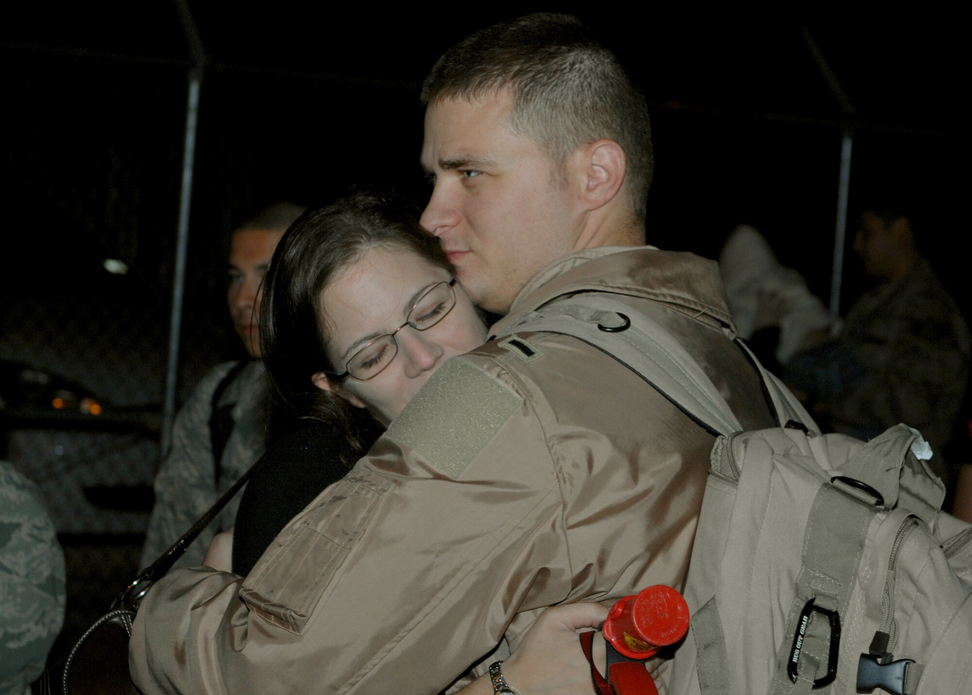 DYESS AIR FORCE BASE, Texas -- First Lieutenant Jeff Mitchell, from the 40th Airlift Squadron, is greeted by his wife after his return home from a four month deployment to Southwest Asia Oct. 20. (U.S. Air Force photo/Senior Airman Jennifer Romig)