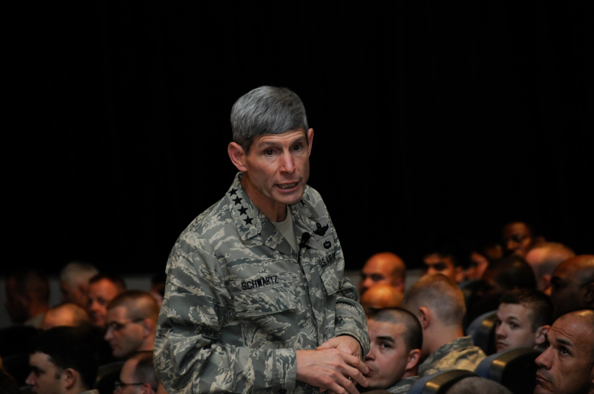 Air Force Chief of Staff Gen. Norton Schwartz speaks to an assembly of Airmen gathered from the 379th Air Expeditionary Wing Oct. 20.  The general thanked Airmen for their contributions as part of the joint team supporting the Global War on Terror.   The visit marked the CSAF's first trip to the U.S. Air Forces Central area of responsibility since his appointment as the Air Force chief of staff. (U.S. Air Force photo by Tech. Sgt. Michael Boquette/Released)