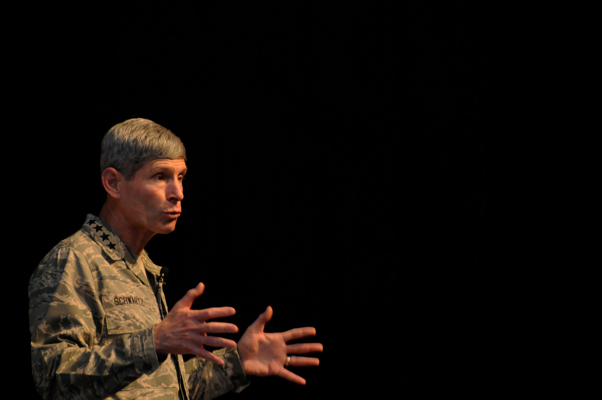 Air Force Chief of Staff Gen. Norton Schwartz speaks to an assembly of Airmen gathered from the 379th Air Expeditionary Wing Oct. 20.  Over 500 Airmen attended the assembly.  The visit marked the CSAF's first trip to the U.S. Air Forces Central area of responsibility since his appointment as the Air Force chief of staff. (U.S. Air Force photo by Tech. Sgt. Michael Boquette/Released)