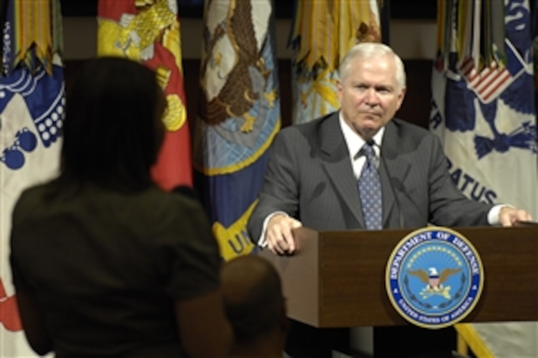 U.S. Defense Secretary Robert M. Gates listens to a military spouse during the Wounded Warrior Summit at the Pentagon, Oct. 20, 2008. Gates promised continued Defense Department commitment to wounded warrior care.