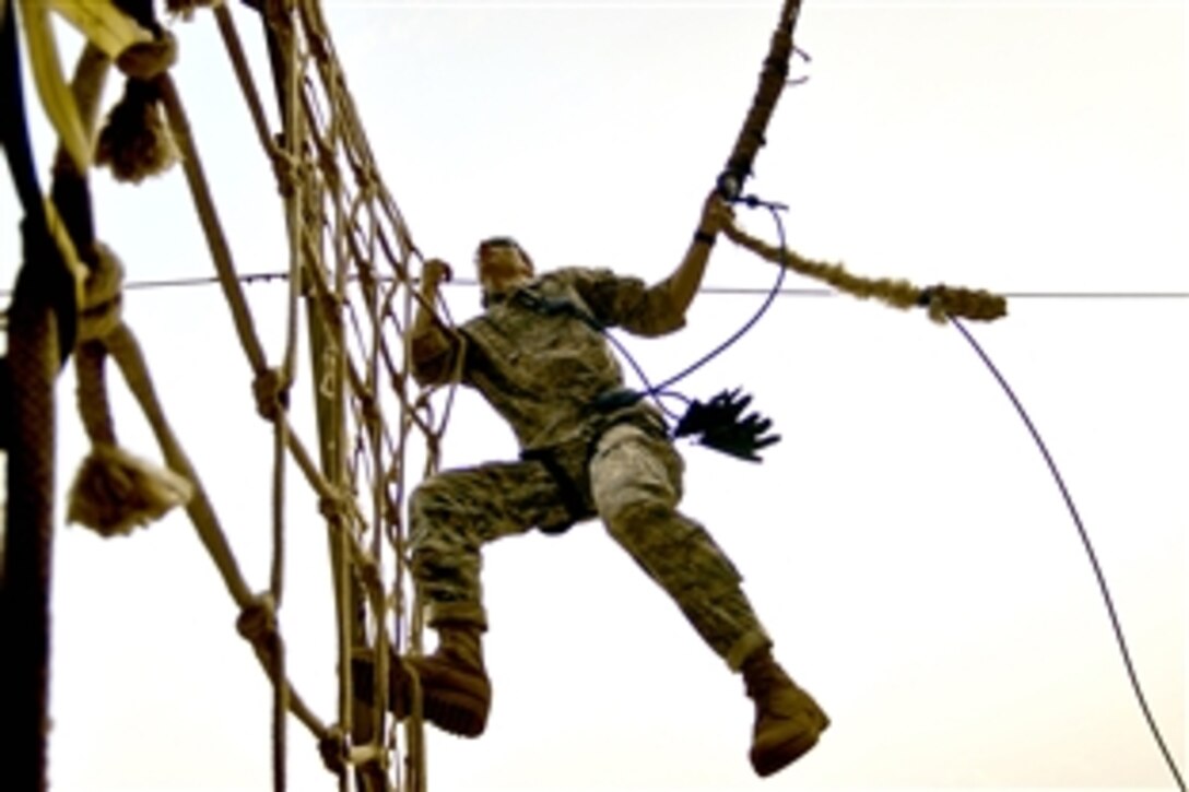 A U.S. servicemember assigned to Combined Joint Task Force Horn of Africa  negotiates a rope obstacle during a 21-day commando course led by members of the French Foreign Legion in Arta Beach, Djibouti, Oct. 18, 2008.