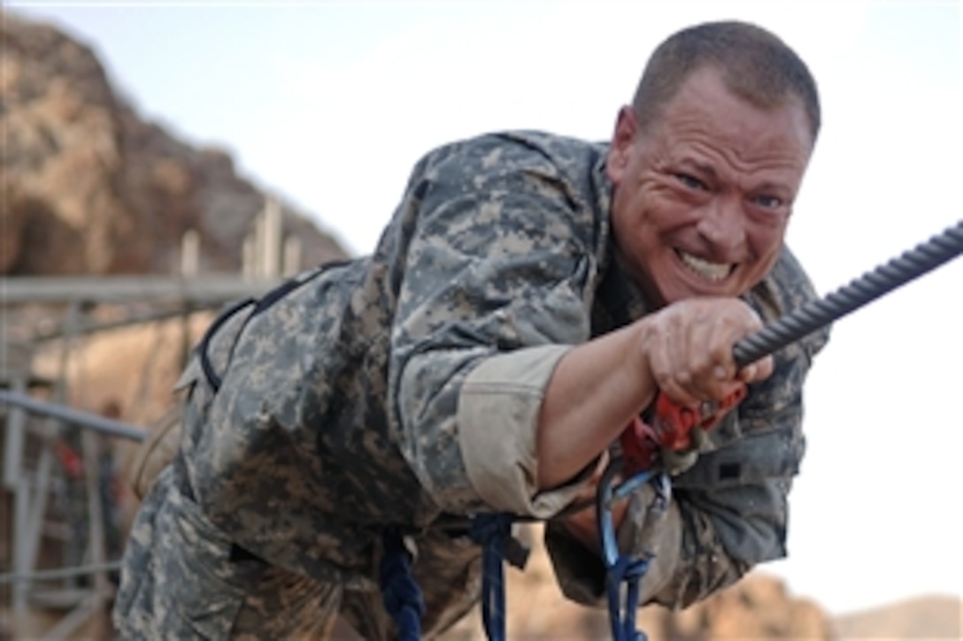 U.S. Army Master Sgt. Ralph Chisolm transits an obstacle course in Arta Beach, Djibouti, Oct. 18, 2008. Chisolm is assigned to the 2nd Battalion, 18th Field Artillery Regiment, Combined Joint Task Force - Horn of Africa. More than a dozen servicemembers assigned to CJTF-HOA participated in an annual three-week course hosted by members of the 13th Demi-Brigade, French Foreign Legion.