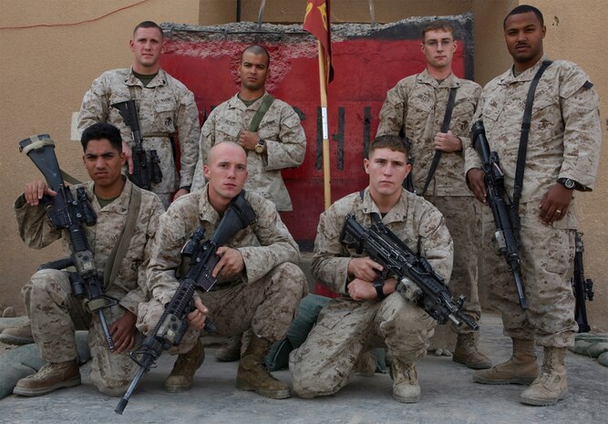 Marines with 1st Squad, 2nd Platoon, Company C, Task Force 1st Battalion, 2nd Marine Regiment, Regimental Combat Team 1, gather for a squad photo just days after conducting a recent cordon and search operation, which led to the detainment of the battalion’s number one High Value Individual. The Marines acted as the assault section during the operation, which was successfully completed with no casualties to Marines, local nationals or the HVI.