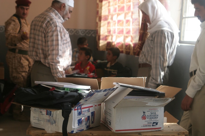 Boxes of school supplies sent by Marines' friends, family and organizations in the U.S. were distributed to students and teachers by the Iraqi Army at an elementary school in Khasfah, Iraq, Oct. 21. Since security of al-Anbar province has been given back to the Iraqi government, the IA has started playing a bigger role in operations as the Marines with the Baghdadi Military in Transition Team, which is assigned 3rd Battalion, 2nd Iraqi Brigade, 7th Iraqi Division, have stepped back and supervised.