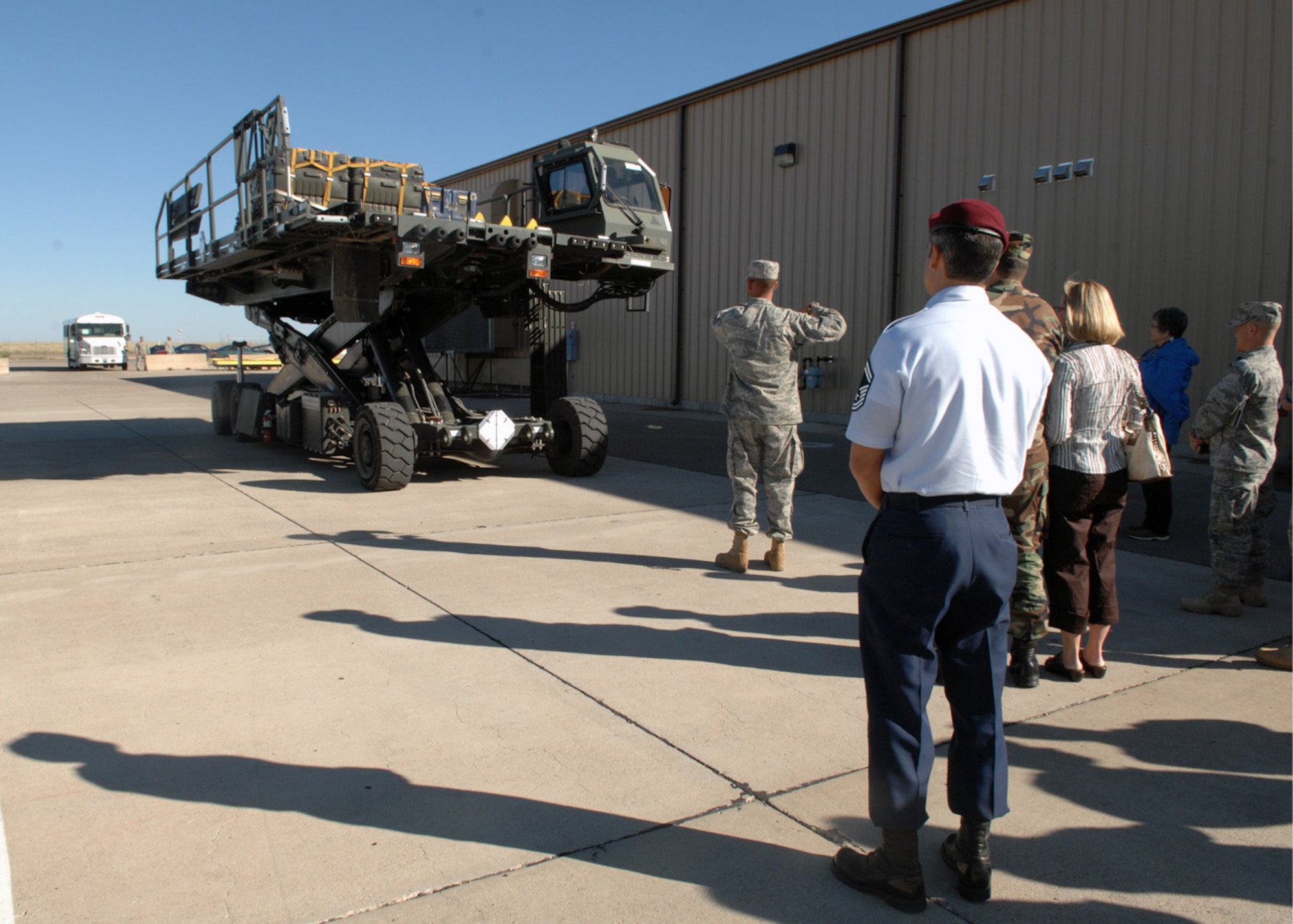 Senior Master Sgt. Raymon Colon-Lopez, commandant for the Air Force Pararescue in Combat Rescue Officer School watches the rising of the 25K-Loader at the Deployment Control Center Marshalling Yard, October 17. During his tour around Holloman Air Force Base, N.M., distinguished visitor Sergeant Colon-Lopez got a glimpse of military operations. (U.S. Air Force photo/Airman 1st Class Veronica Salgado) 