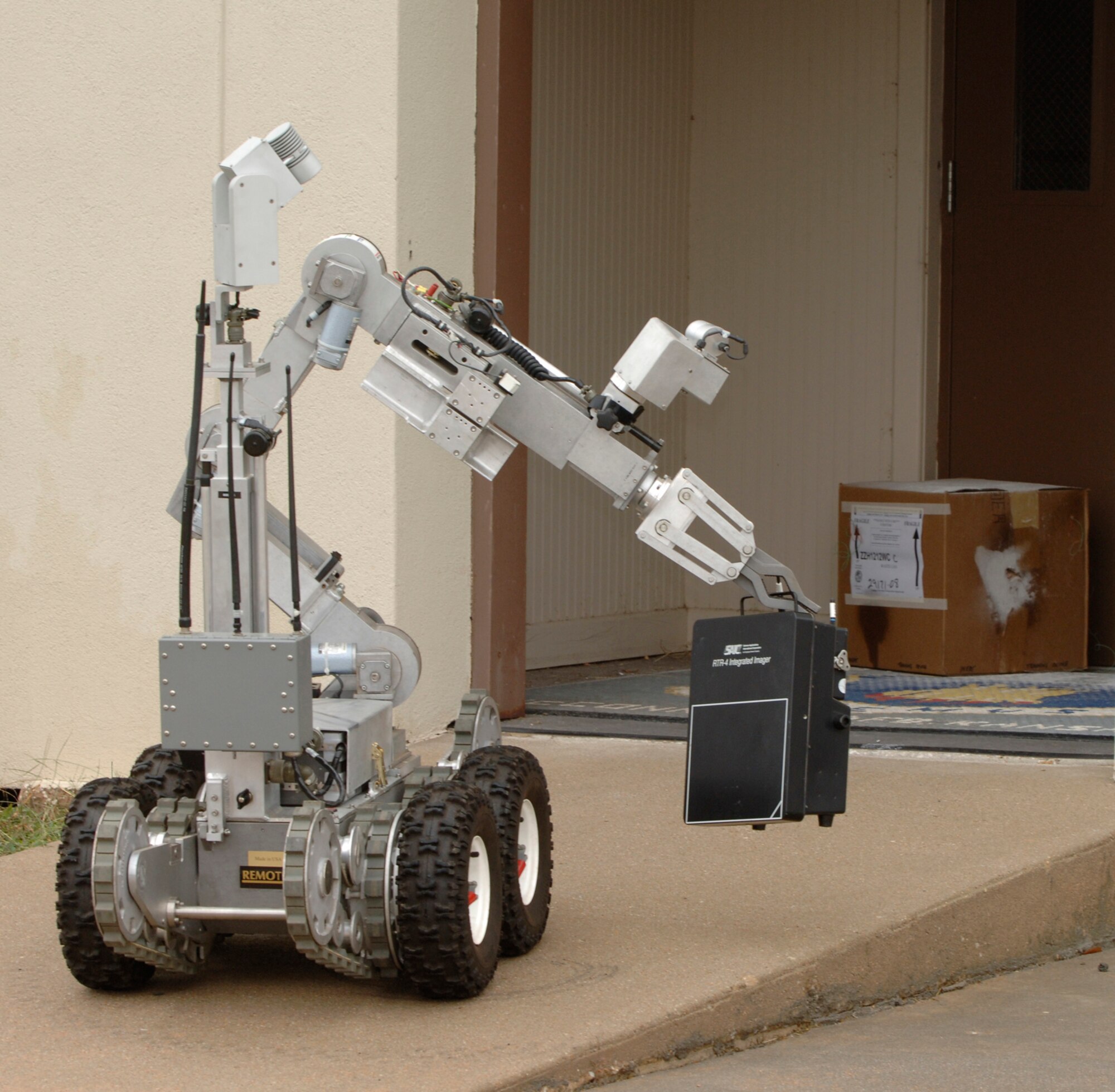 MCCONNELL AIR FORCE BASE, Kan. –An F-6A explosive ordnance robot uses its bomb detection capabilities on a suspicious package outside building 750, during a major accident response exercise, Oct. 15. (Photo by Senior Airman Laura Suttles)
