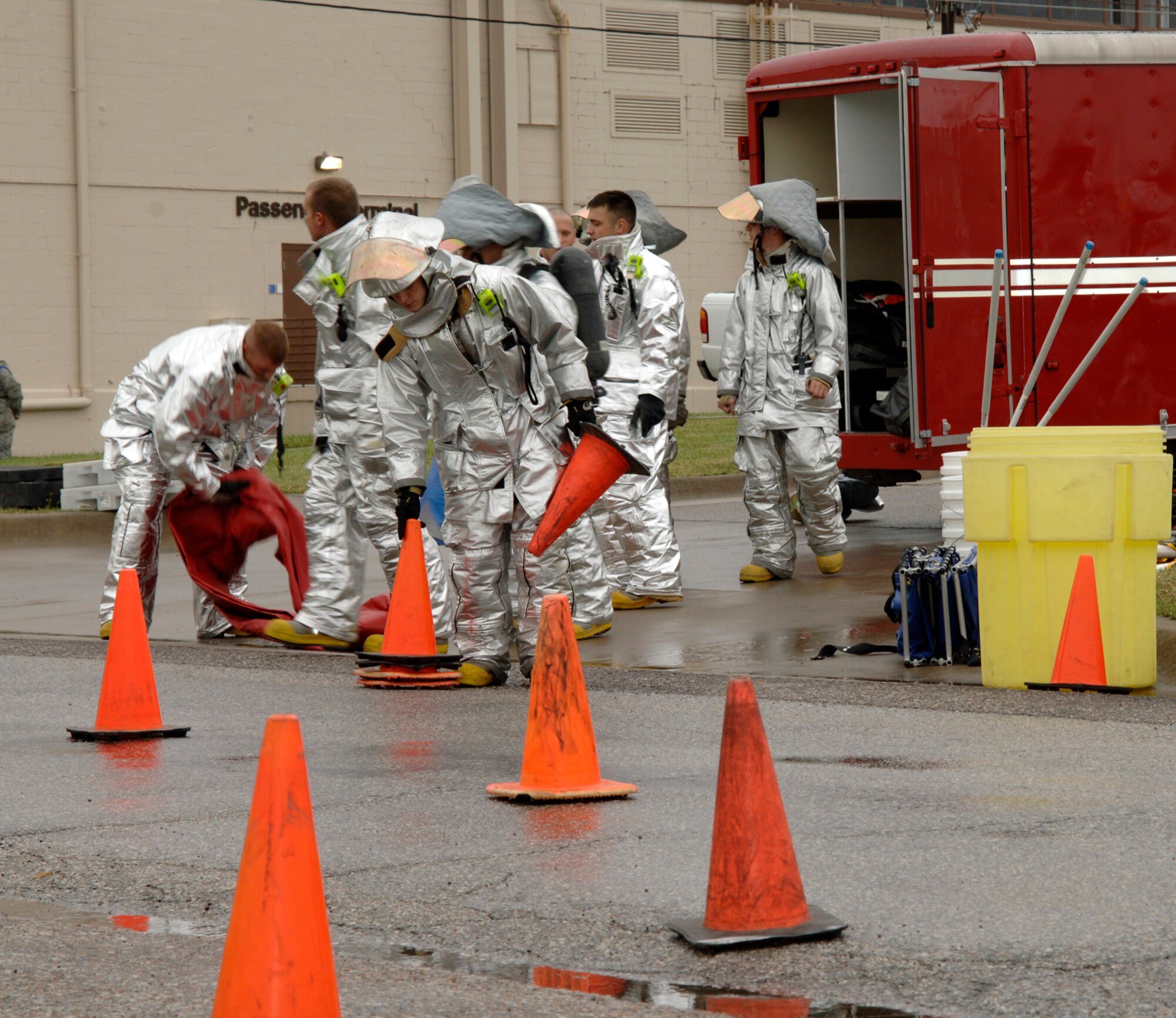 MCCONNELL AIR FORCE BASE, Kan. -- Members of McConnell’s fire department block the street outside building 750, to stage a decontamination area for a major accident response exercise, Oct. 15. The fire department, as the first responder to the contaminated scene, was tested on its ability to assess the situation, set-up necessary precautions and assure procedures were carried out properly until the end of the exercise. (Photo by Senior Airman Laura Suttles)