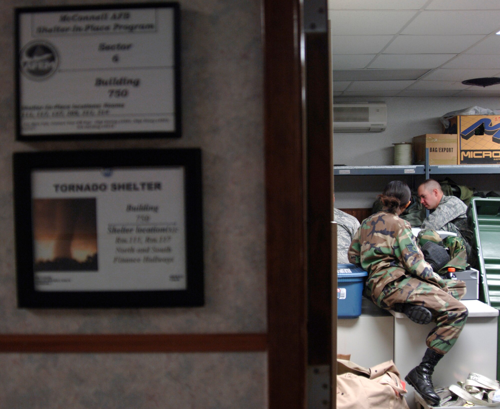 MCCONNELL AIR FORCE BASE, Kan. -- Team McConnell members, from building 750 seek shelter-in-place during a major accident response exercise, Oct. 15. Personnel must shelter-in-place when the possibility of a chemical or biological attack is eminent; during this particular exercise, the chemical agent was identified as Anthrax. (Photo by Senior Airman Laura Suttles)