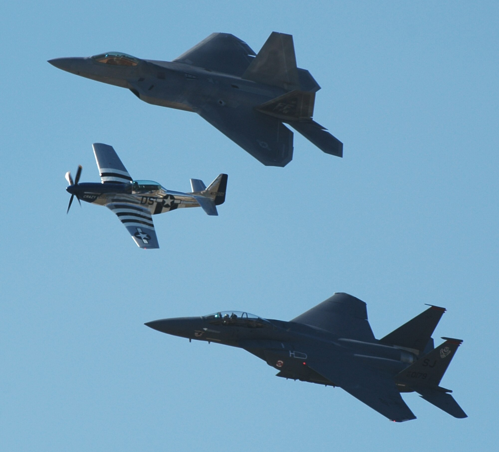 From the top: An F-22 Raptor, P-51 Mustang and F-15E Strike Eagle pay tribute to U.S. airpower from yesterday to today during a heritage flight Oct. 18. The P-51 was used during World War II while the F-15E was built in 1989 and the F-22 was built in 2005. Dobbins hosted the 2008 Wings Over Marietta Air Show Oct. 18-19, which featured the U.S. Air Force Thunderbirds. (Air Force photo/Senior Airman Shaun Shenk)