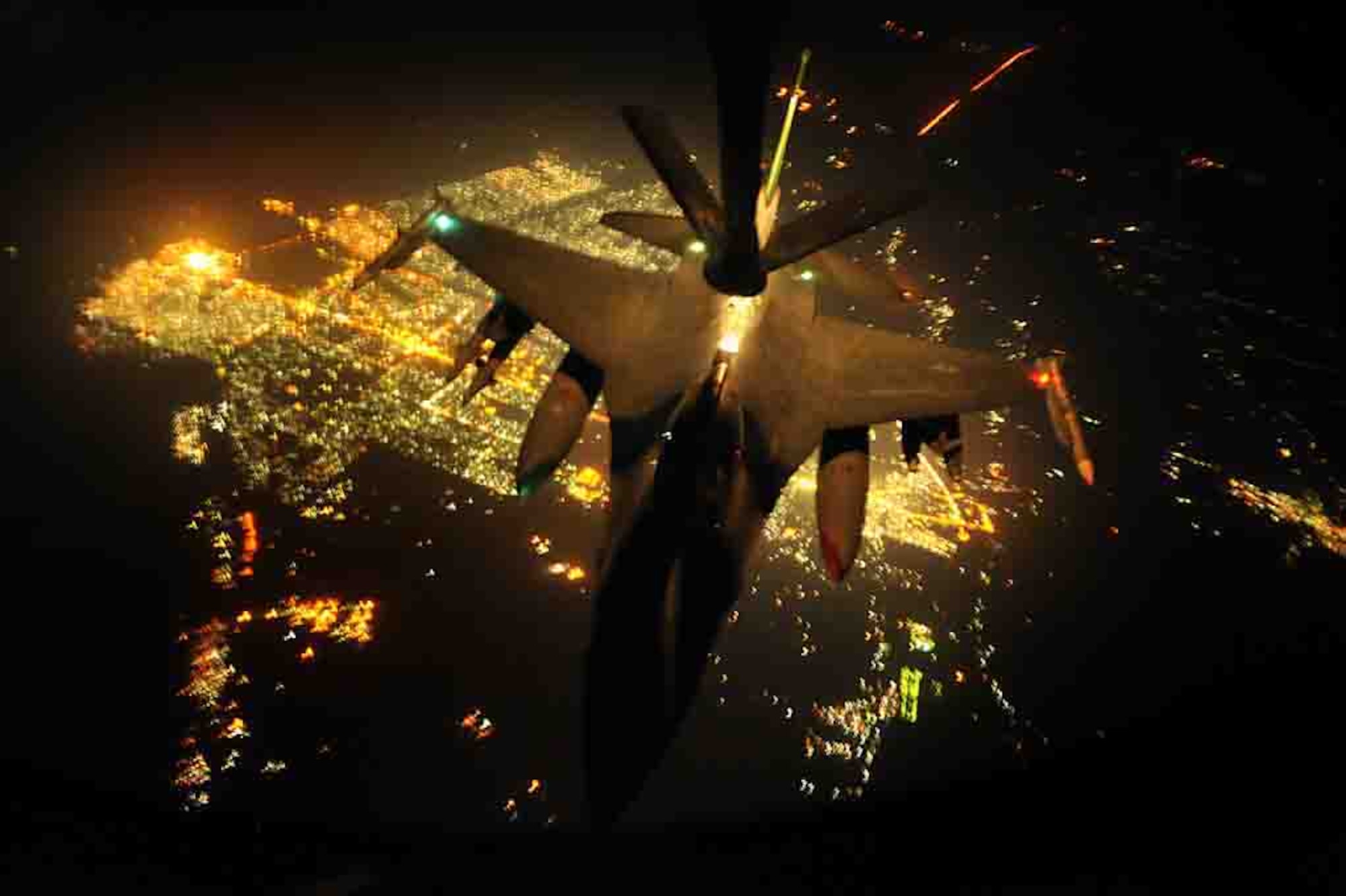 An F-16 Fighting Falcon is refueled by a KC-135 Stratotanker during a combat mission Sept. 3 over Iraq. The KC-135 is from the 763rd Expiditionary Refueling Squadron, and the F-16 is from Joint Base Balad, Iraq. (U.S. Air Force photo/Staff Sgt. Aaron Allmon II) 
