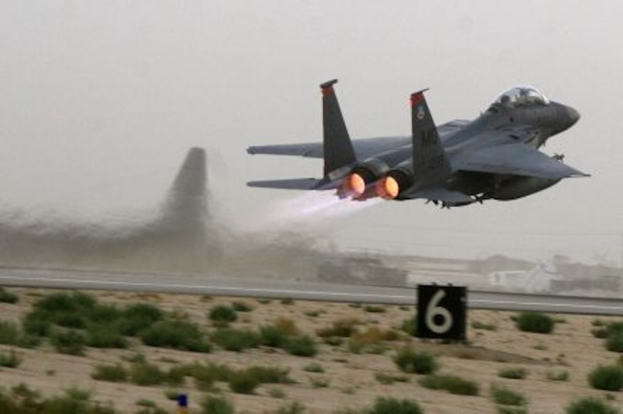 An F-15E Strike Eagle takes off from an air base in Afghanistan. The F-15E is a dual-role fighter designed to perform air-to-air and air-to-ground missions. An array of avionics and electronics systems gives the F-15E the capability to fight at low altitude, day or night, and in all weather. (U.S. Air Force photo)
